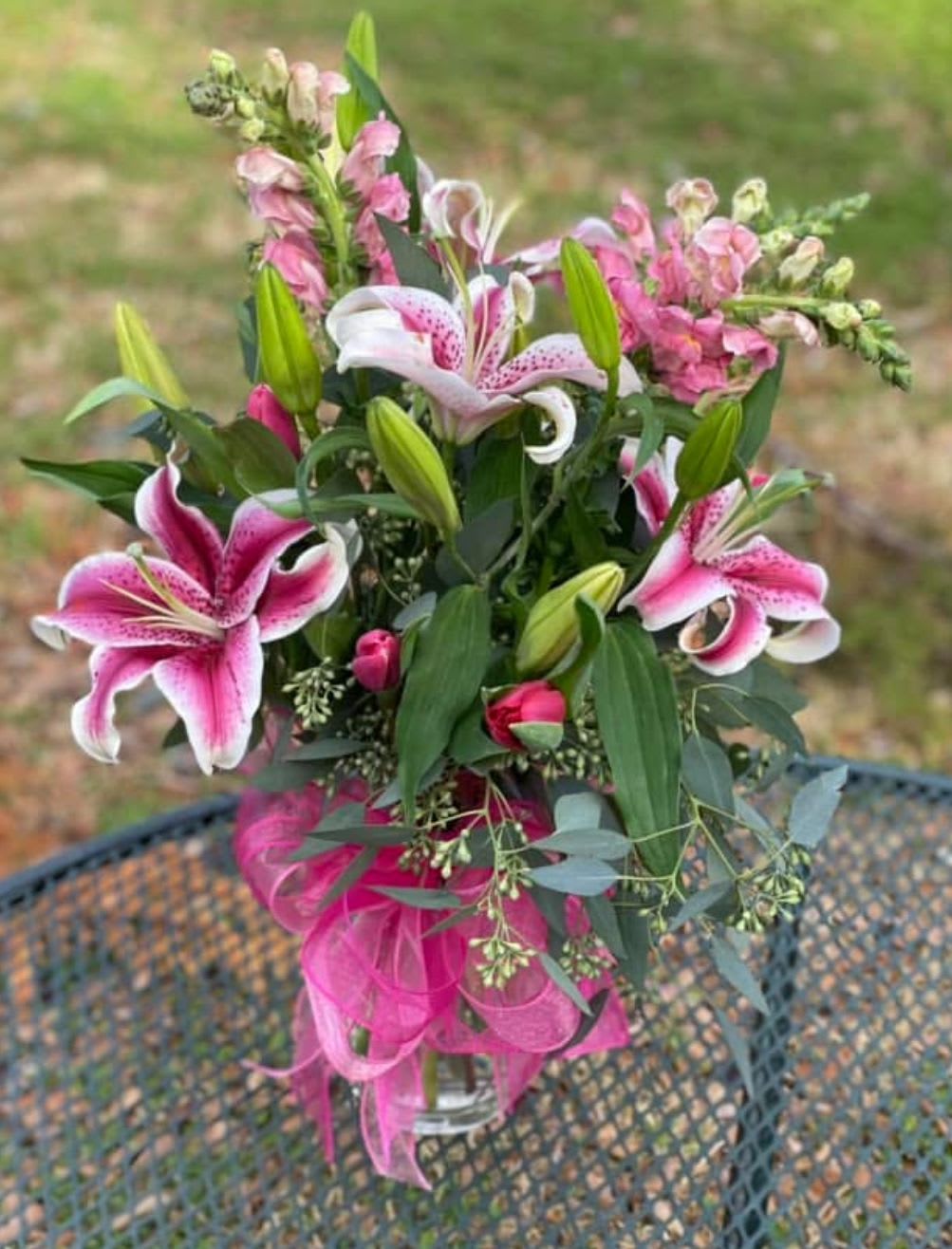 Pink Lily Delight  - pink lillies, pink roses, pink alstroemeria, tulips and variety of in season pink flowers. 