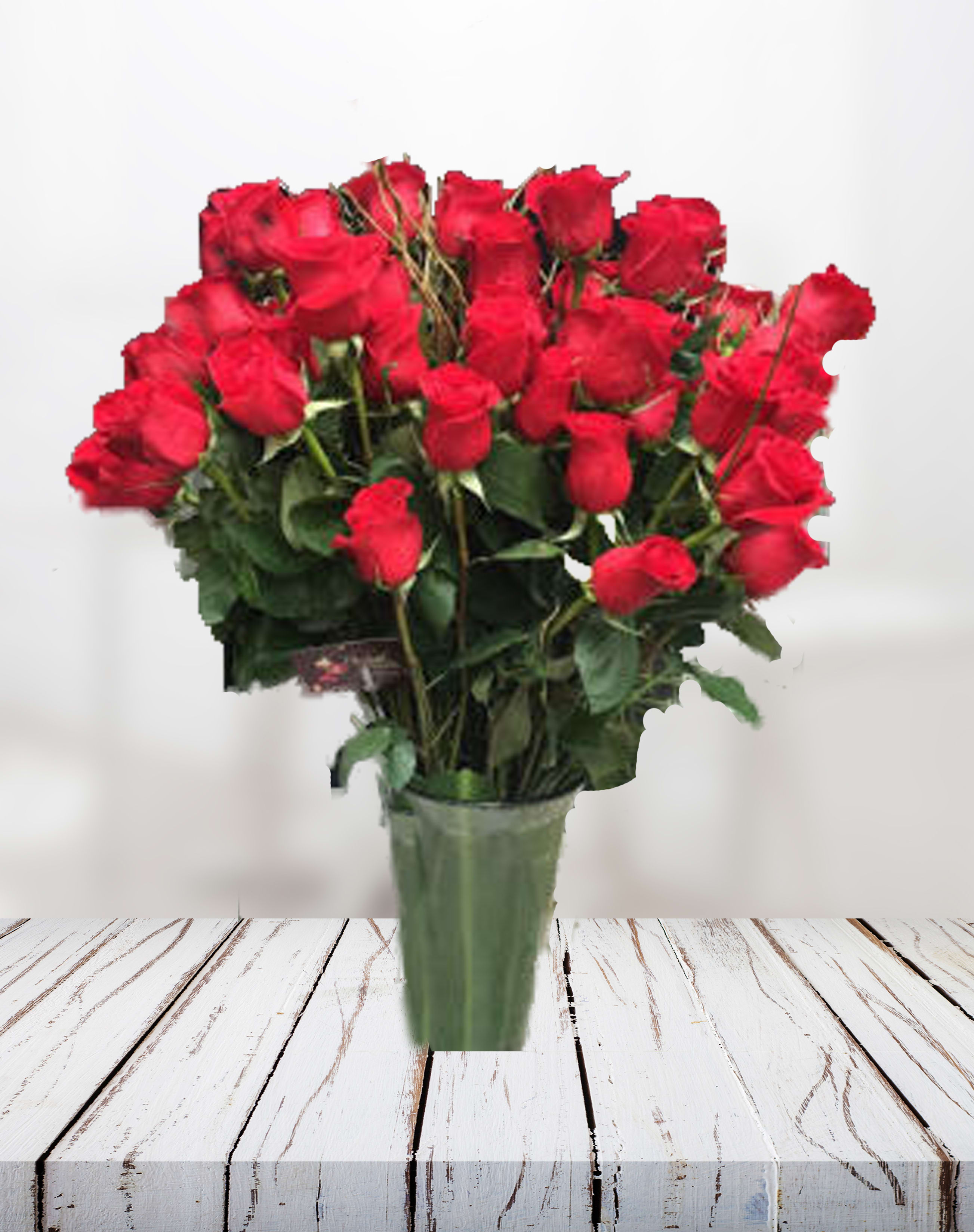 Two Dozen Red Roses in Vase - An impressive presentation of two dozen (24 stems) of fragrant, long-stemmed red roses accented with greenery is a classic gift that symbolizes love.   *Each bouquet is unique and design style may vary slightly.