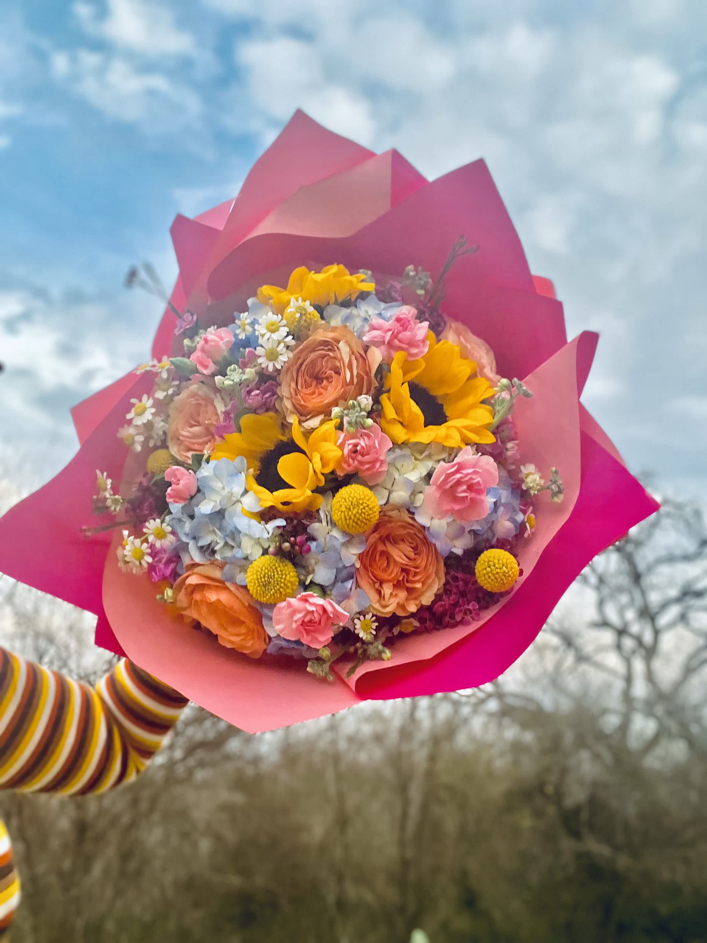Pink &amp;  Blue Sunflower Hand Wrapped Bouquet  - Designer Choice Sunflower hand Wrapped bouquet. Filled with Roses, Hydrangeas, Stock and pink filler  