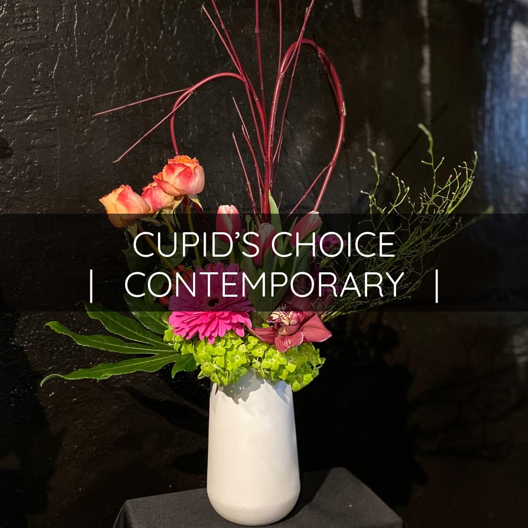Cupid's Choice - Contemporary - Let our little Cupids make something special for Valentine's Day.   This design style is made special by utilizing structured materials, negative space, and different techniques to set our designs apart from the rest.   Most designs are left with minimal greenery and work around the natural shape of the flowers and materials. Allow our designers to create something unique utilizing the freshest materials the season has to offer.  We will do our utmost best to incorporate Valentine's Day colors unless otherwise specified.