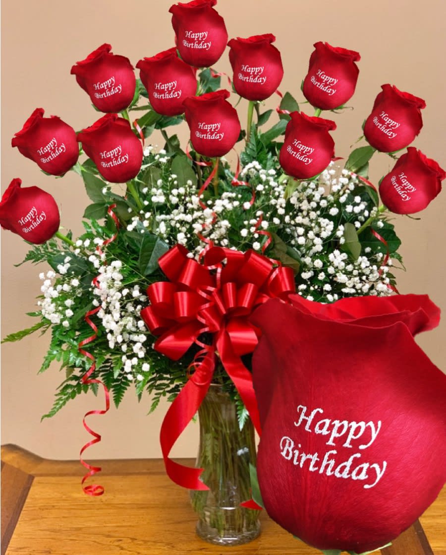 "Happy Birthday" 12 Personalized Roses - One dozen long stem roses each individually rose personalized with the message as shown, will arrive arranged in a glass vase, greens, filler and bow. VIP Floral Designs uses only the highest quality roses.  For out of states deliveries, the flowers will arrived in our beautiful gift gold box (See picture attached). All roses arrive with water tube, flower food package, card instructions, greens and filler.