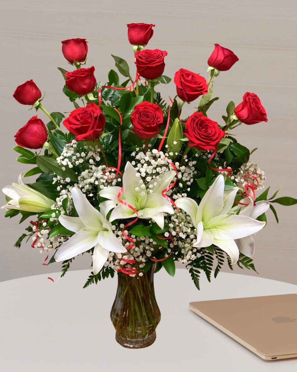 "Come live in my heart" - 12 Long Stems Premium Roses arrived perfectly arranged in a glass vase with baby's breath, greens and a nice red bow. 