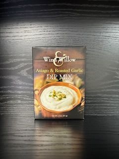 Asiago &amp; Roasted Garlic Dip Mix - Rich, savory, and irresistibly smooth — this Asiago &amp; Roasted Garlic Dip Mix from Wind &amp; Willow is a flavor-lover’s dream. Creamy Asiago cheese combines with the mellow sweetness of roasted garlic for a decadent dip that’s as comforting as it is delicious.  Perfect for entertaining or elevating everyday snacks, this dip pairs wonderfully with crusty bread, crackers, or crisp vegetables. Mix with sour cream and mayonnaise for a cold dip, or blend with cream cheese and heat for a warm, melty version.