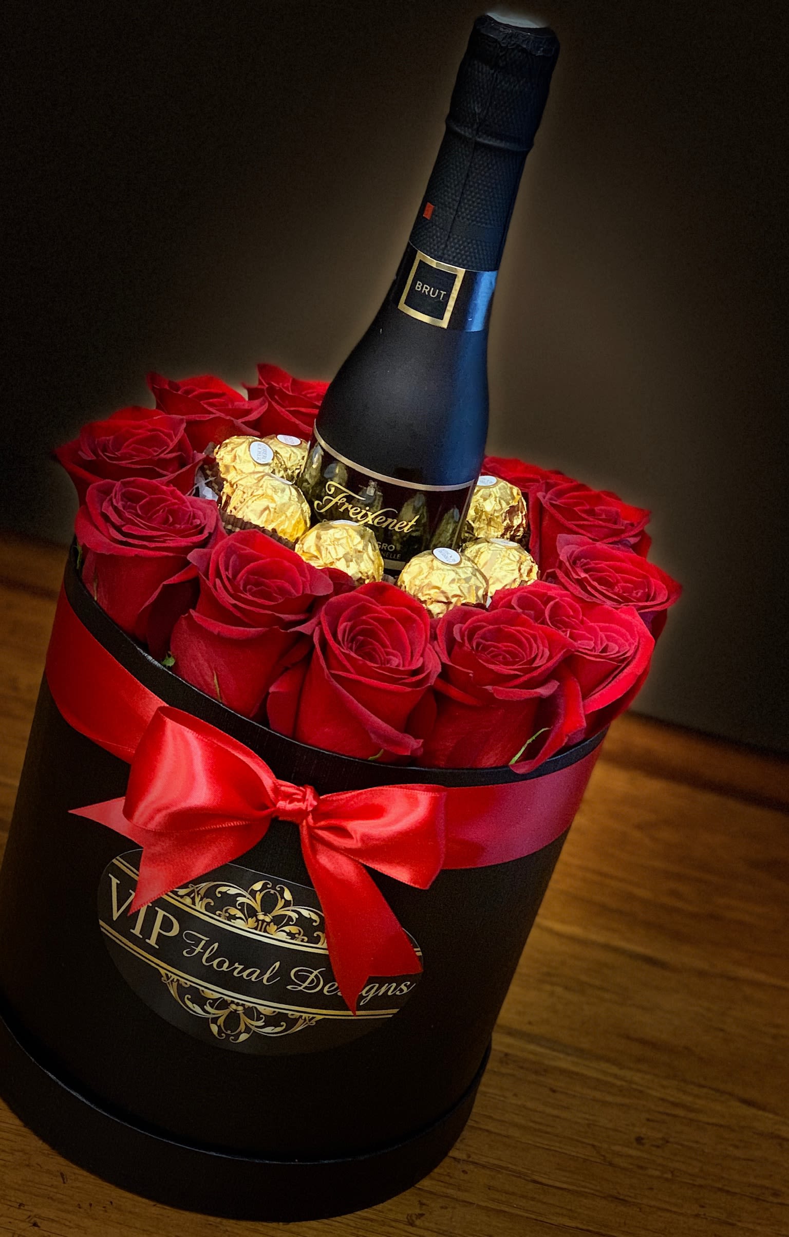 My Forever Valentine - Our luxury signature hat box is made with 12 Fresh Roses, 8 Fererro Chocolate and Freixenet Cordon Negro Brut Cava Champaign (187 ml). You must be 21 years of age or older to order, purchase or receive delivery of wine. A person who is 21 years of age or older must be home to sign for the delivery. 