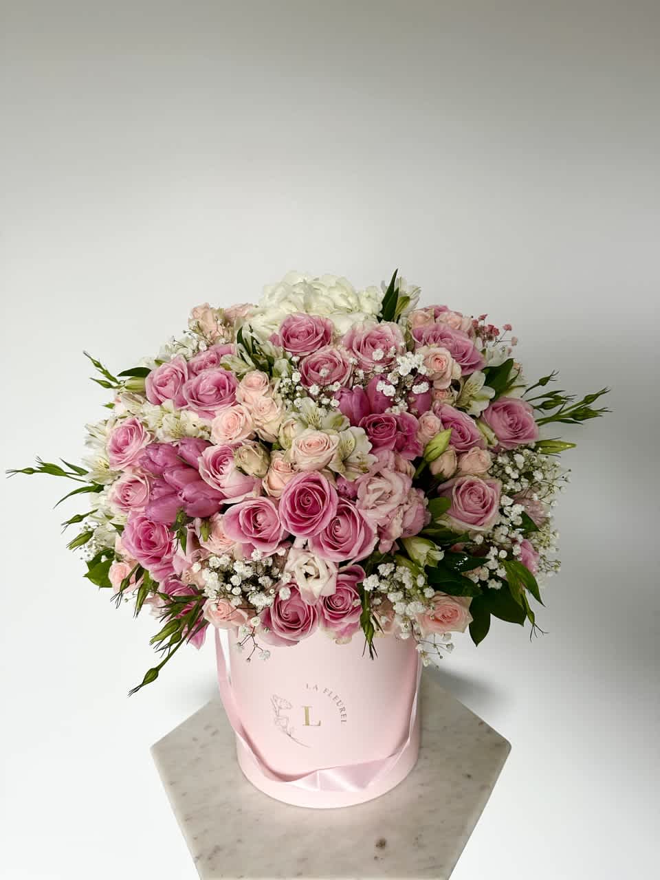 Rose Arrangement - This beautiful arrangement filled with the roses, spray roses, hydrangeas and greens to deliver your special message to your special someone.  Perfect for any occasion. You can choose any color of the box.  Arrangement includes: Medium box measured at 9.75" Dia. x 9.25" H Custom greeting card