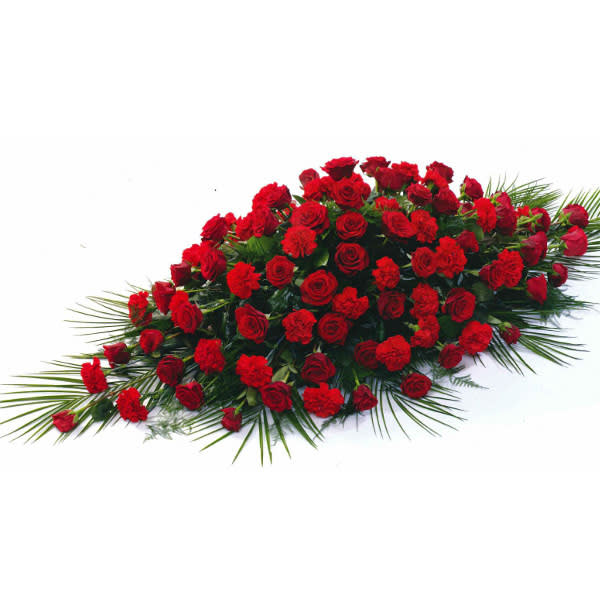 Roses and Carnations Casket Spray - The deep red flowers of this casket spray design speak to the depth of your loss. Express your love with the simple elegance of this traditional spray, perfectly sized for a half or full casket.  Standard - Half Casket Spray - 48 Stems - Approximately 38" (W) x 27" (H) Deluxe - Half Casket Spray - 60 Stems - Approximately 38" (W) x 27" (H) Premium - Full Casket Spray - 84 Stems - Approximately 60" (W) x 28" (H)  Casket flowers are typically reserved for the closest family members, often the spouse, children, or siblings of the deceased. When shopping for casket spray flowers, you'll find two types of arrangements to choose from. Full casket sprays are placed in the middle of the casket and are larger than half casket spray flowers. Full casket arrangements are usually ordered if it is a closed casket funeral. Whereas the smaller half casket sprays are typically used for half-open casket services.