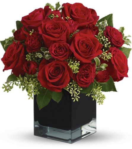 Teleflora's Ravishing Reds - TFWEB596 - Lush, lavish and spectacularly chic, this gorgeous contemporary bouquet of red roses in a stunning black cube vase makes an exciting gift for almost anyone. Wouldn't you love for someone to send it to you?  The brilliant bouquet includes red roses and red spray roses.  Delivered in a black contemporary glass cube vase.  Bouquet is approximately 11.5" H x 10.75" W  Orientation: All-Around  As Shown : TFWEB596