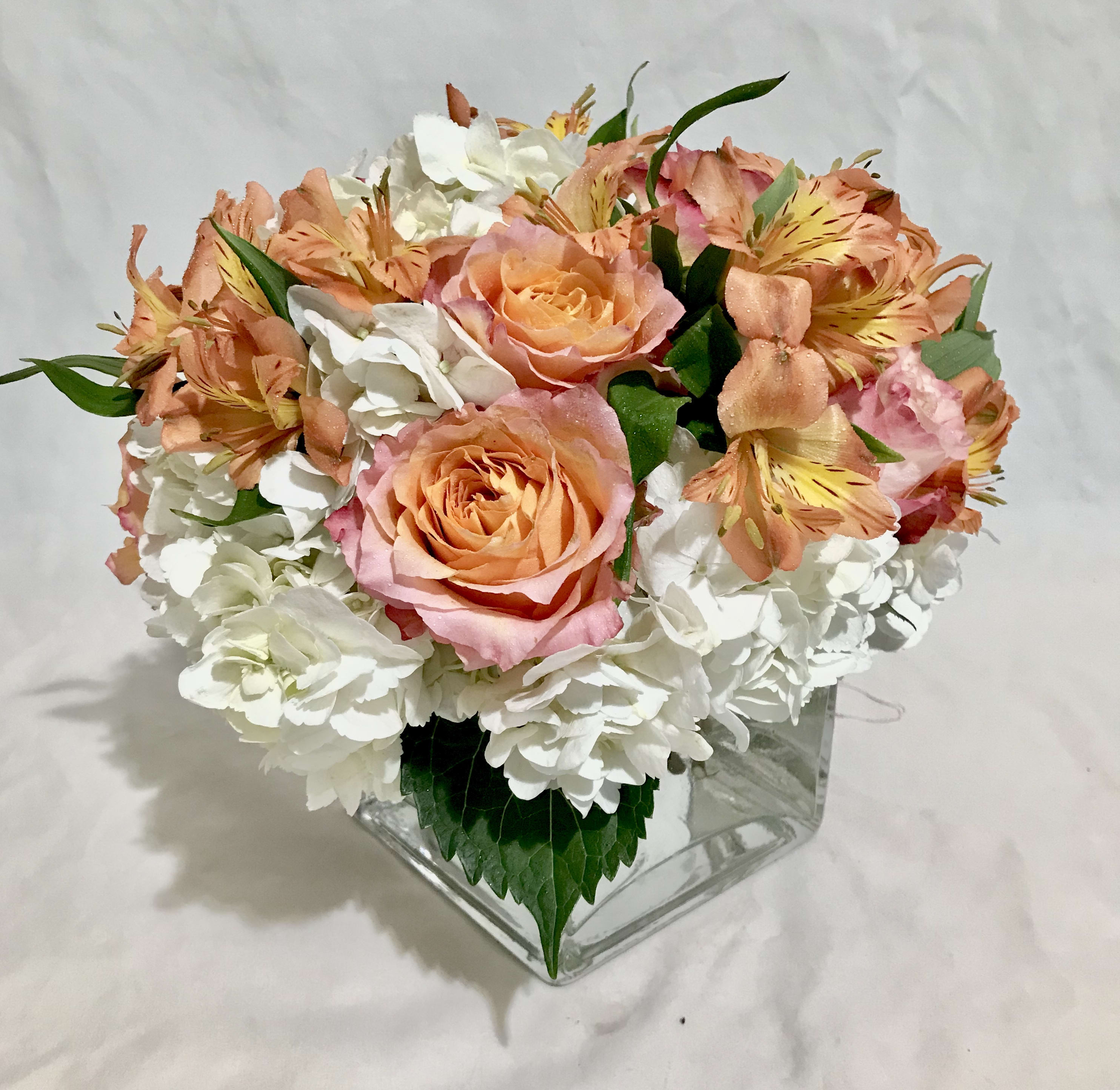 Lush and plush peach blooms - A peachy mix of hydrangeas roses and alstroemerias 