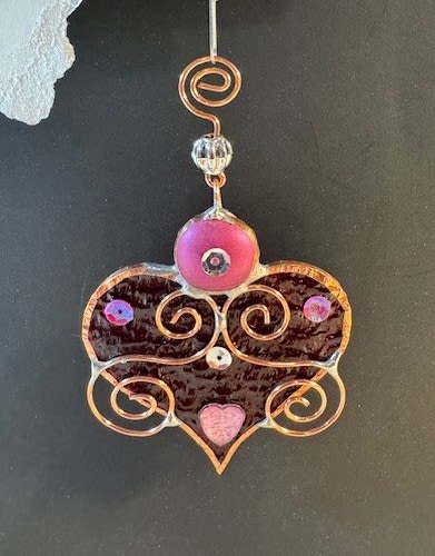 A Bit of My Heart Stained Glass Keepsake (burgundy) - These beautiful hearts say it all!!! They are made out of stained glass and come in several different colors and tones of pink and red.  They can be hung by a suction cup (not included) or by a piece of thread from lamps, mirrors, windows, etc.  Can be used as an add-on to any of our floral arrangements of shipped as a separate item.  These hearts are available as wholesale items by reaching out to us at 540-810-2161.