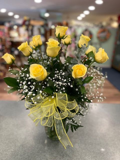 Yellow Roses (R12Y) - One dozen long stem yellow roses with assorted greens and accent flower finished with a coordinating bow.  