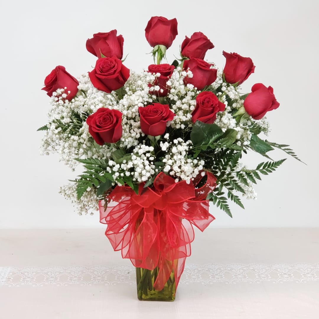 Swoon - A dozen of our best long stem red roses in a glorious bed of babies breath. Let the swooning begin! 