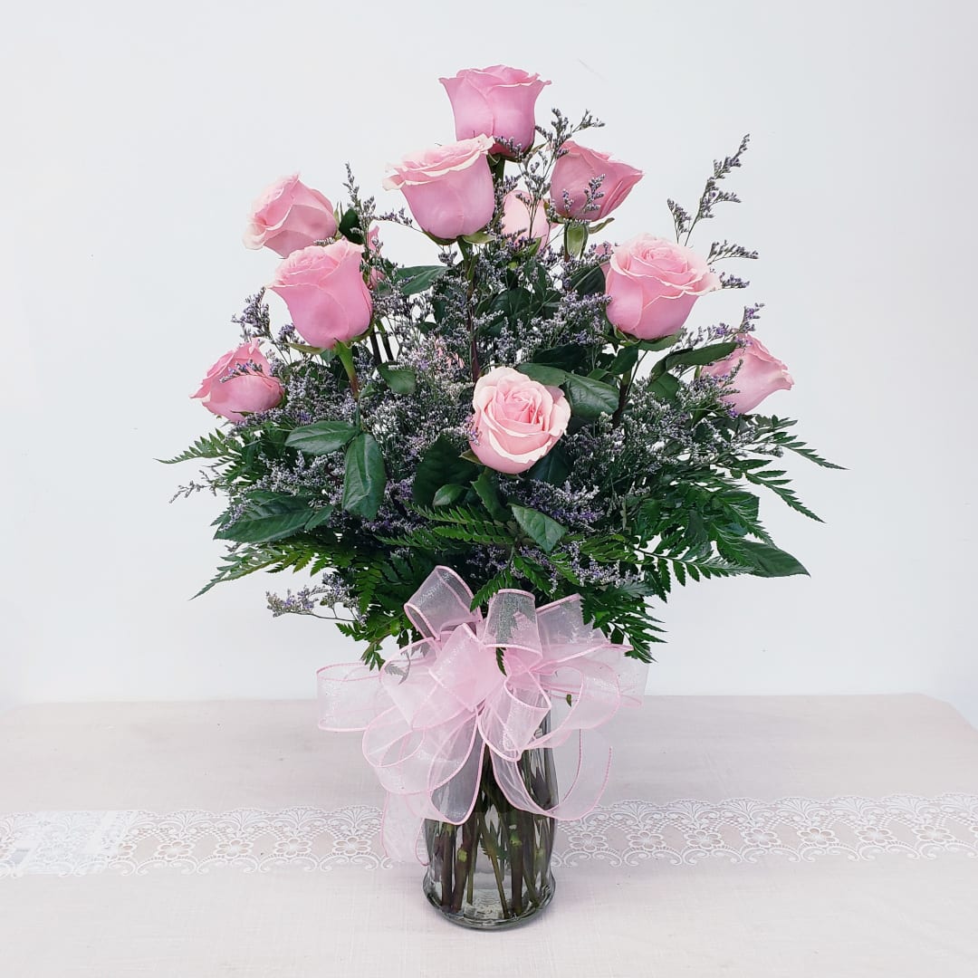 Sweet Pink Bouquet - For your queen... gentle, alluring, and oh so sweet... it has to be pink! One dozen of our finest long stem pink roses with a matching hand tied bow. 