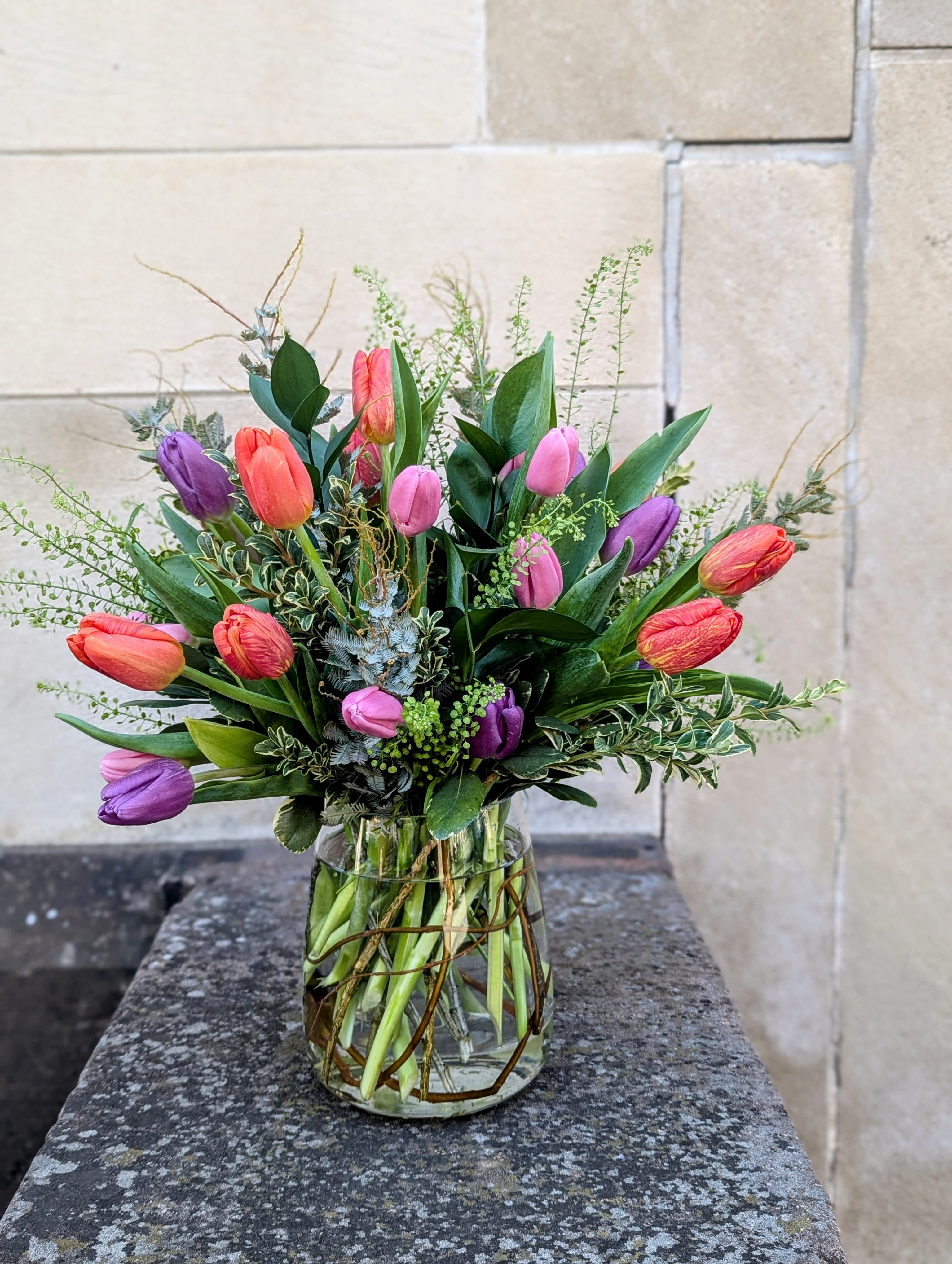 Mixed tulip bouquet  - Mixed tulips and lush seasonal foliage. Colors may vary based on availability. Let's look forward to spring!