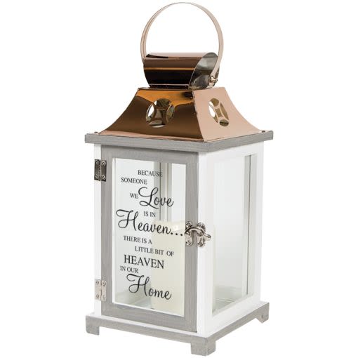 "Heaven" Memorial Lighted Lantern - Our Light The Way Memorial Lanterns are made from quality composite wood and a stainless steel copper finish top. They feature a built-in automatic timer which runs for 6 hours on and 18 hours off(3-AAA batteries are included) and are inscribed with sentimental quotes.  Suitable for hanging or free-standing use inside.  Choose deluxe if you would like to add a Silk arrangement on lid of lantern.  W: 6.25" H: 13.5" D: 6.25"