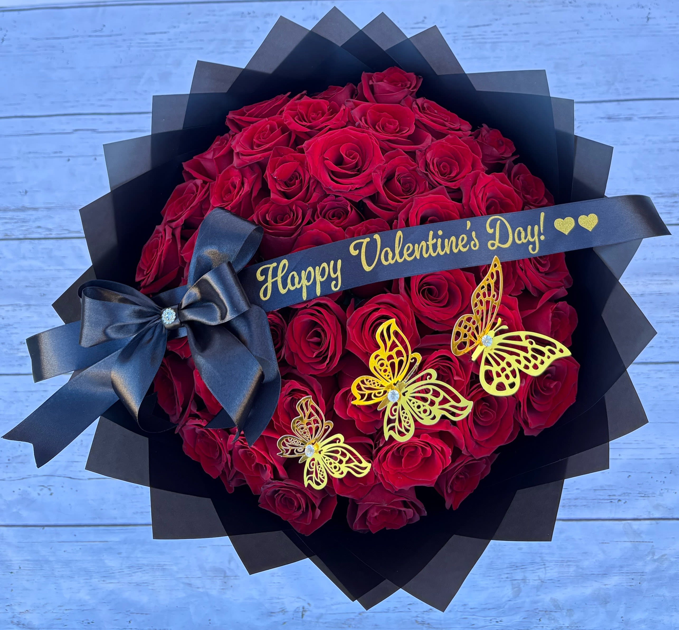 Red roses Maxi Bouquet - 48 long red roses wrapped in black paper with butterflies and a beautiful personalized ribbon