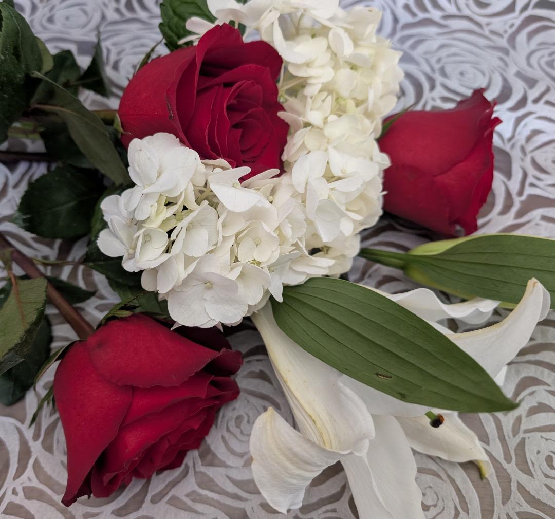 VALENTINE'S DESIGNERS CHOICE - Assortment of red and white flowers , Red roses, hydrangeas and more
