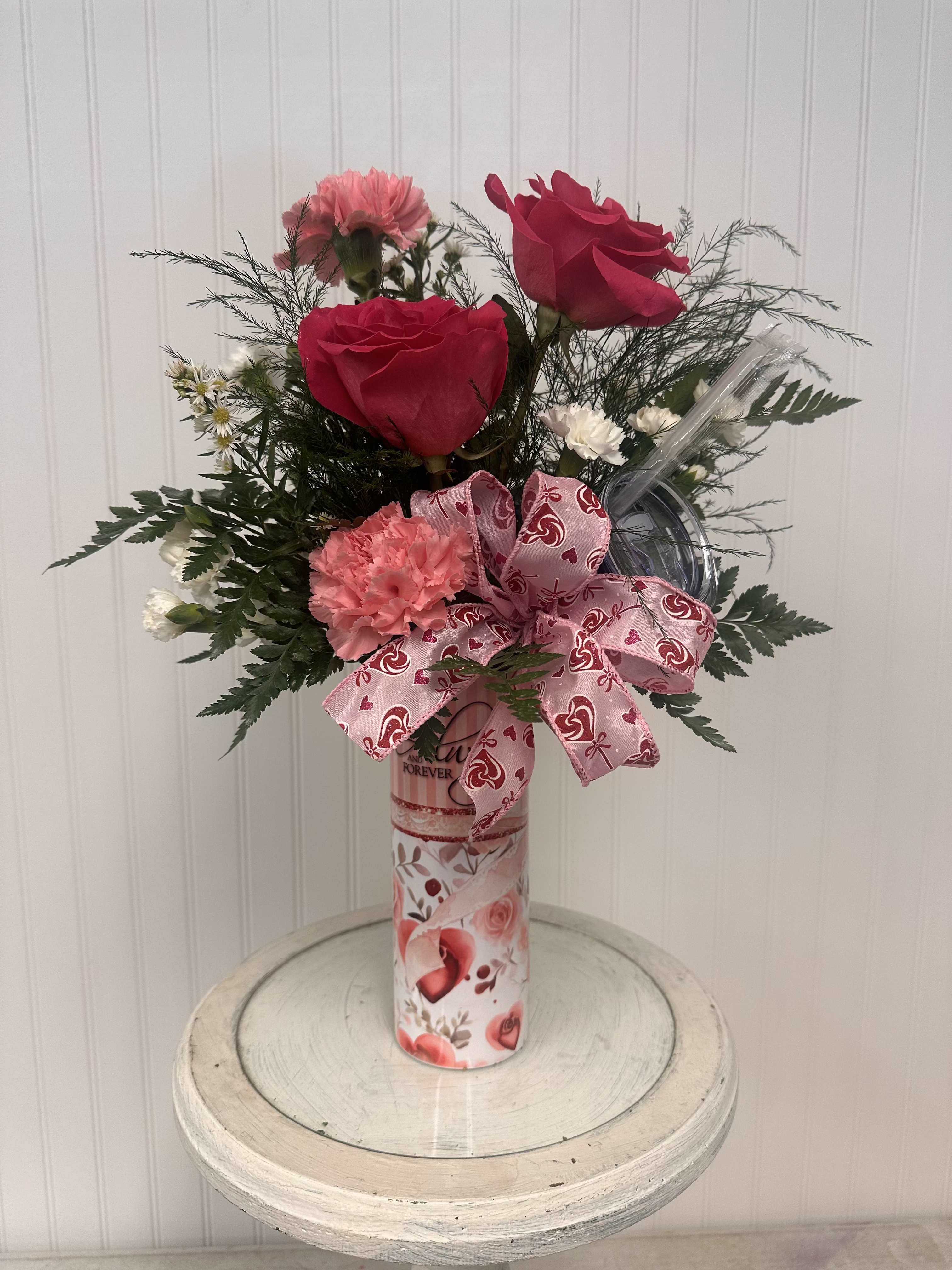 Valentine's Tumbler Always and Forever 20 oz. - 20 oz. hot/cold tumbler with Valentine's Day flowers. This is a wonderful gift within a gift. Flower choice and color are subject to substitution. 