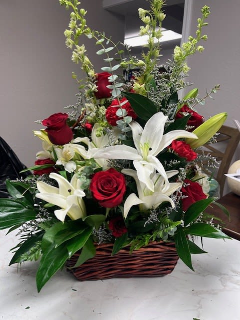 Red &amp; White's Basket  - This beautiful arrangement is full of red roses, red carnations, white lilies, and white larkspur to make the perfect color palette. 