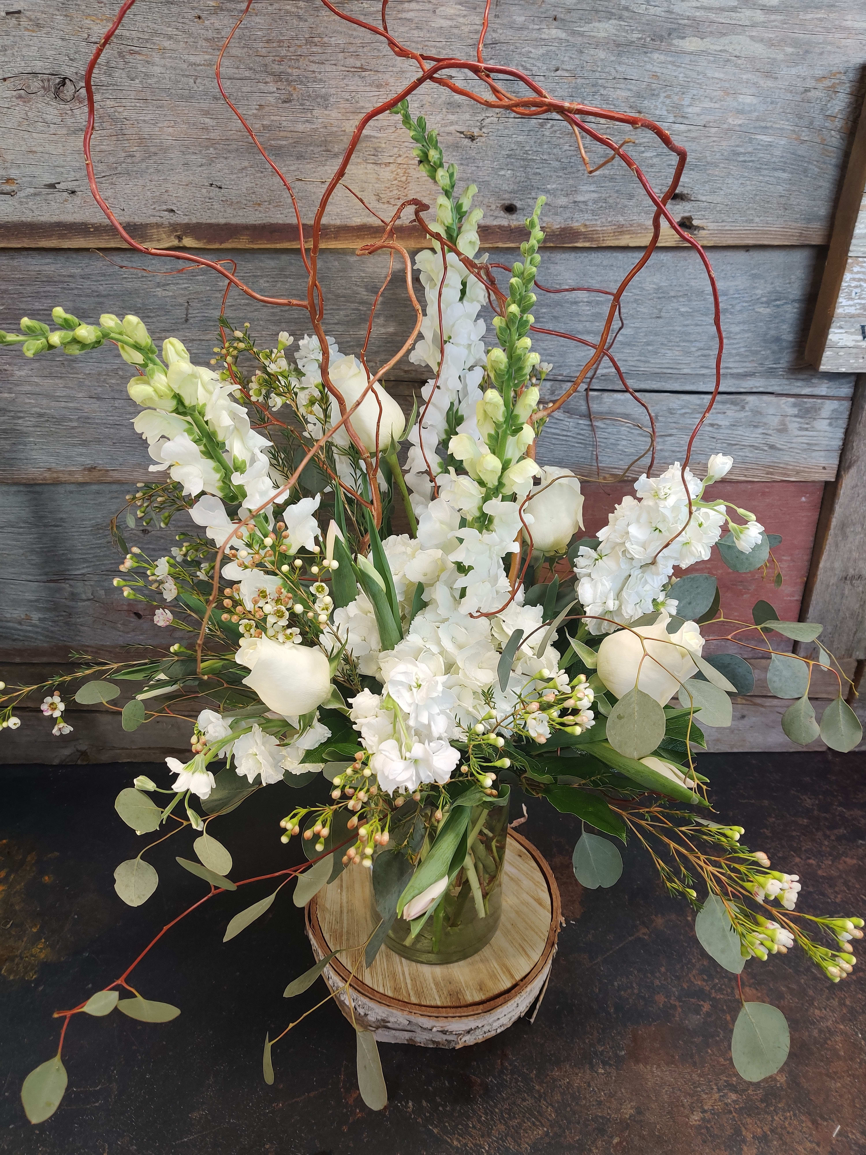  Elegance in White - A beautiful, contemporary white arrangement for your party table. Mixed seasonal flowers for an awesome gift idea 