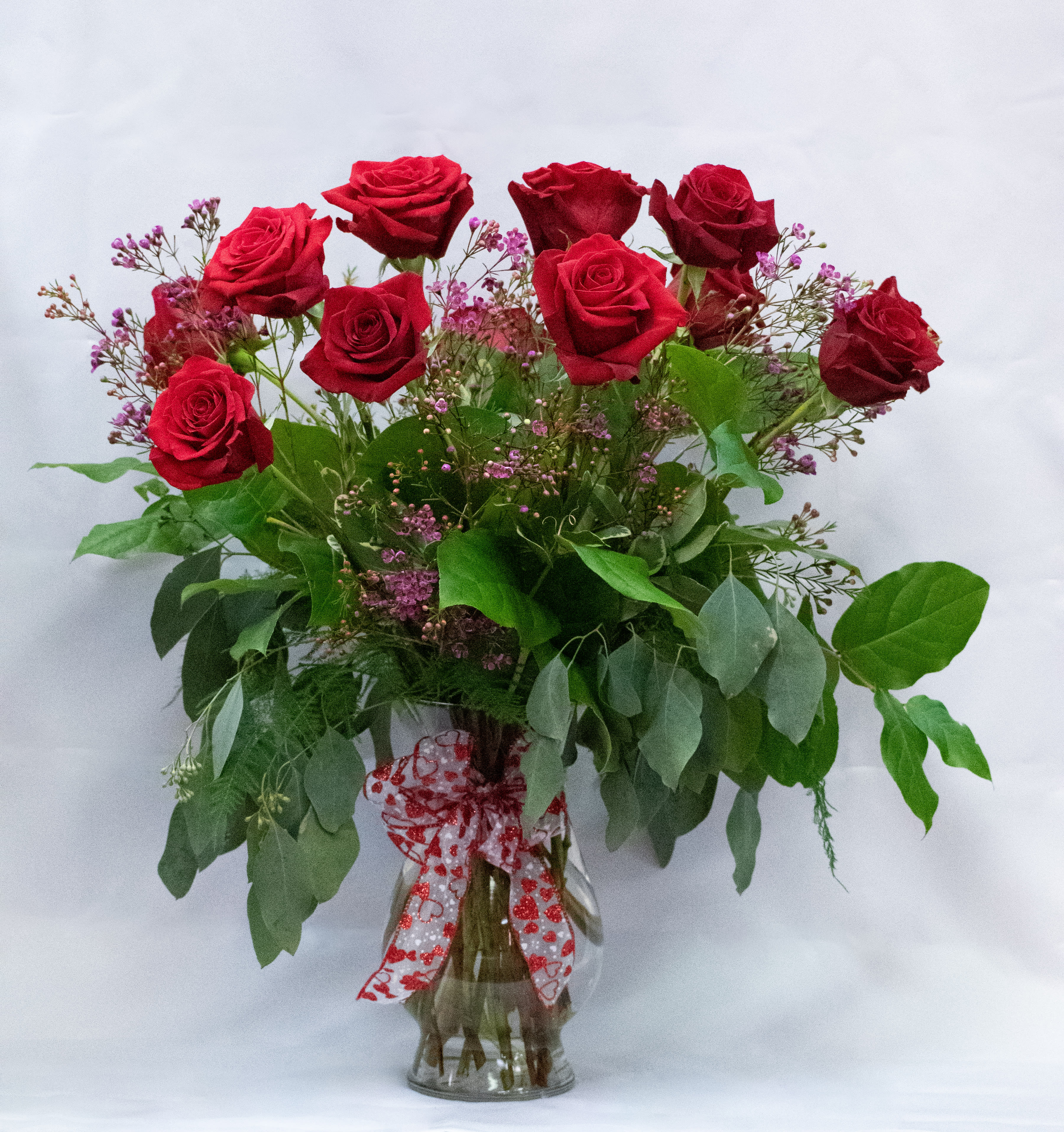 Romantic One Dozen Red Rose Bouquet - A timeless Valentine’s Day classic — one dozen rich red roses beautifully arranged with fresh greenery, expressing love, romance, and devotion in the most unforgettable way. A perfect gesture straight from the heart