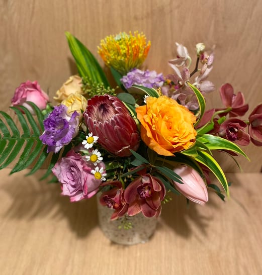 Valentine's Tropical &amp; Seasonal - For those looking for a unique and fresh take on flowers for Valentine's Day. Full of tropical and seasonal blooms. Arranged in a vase.