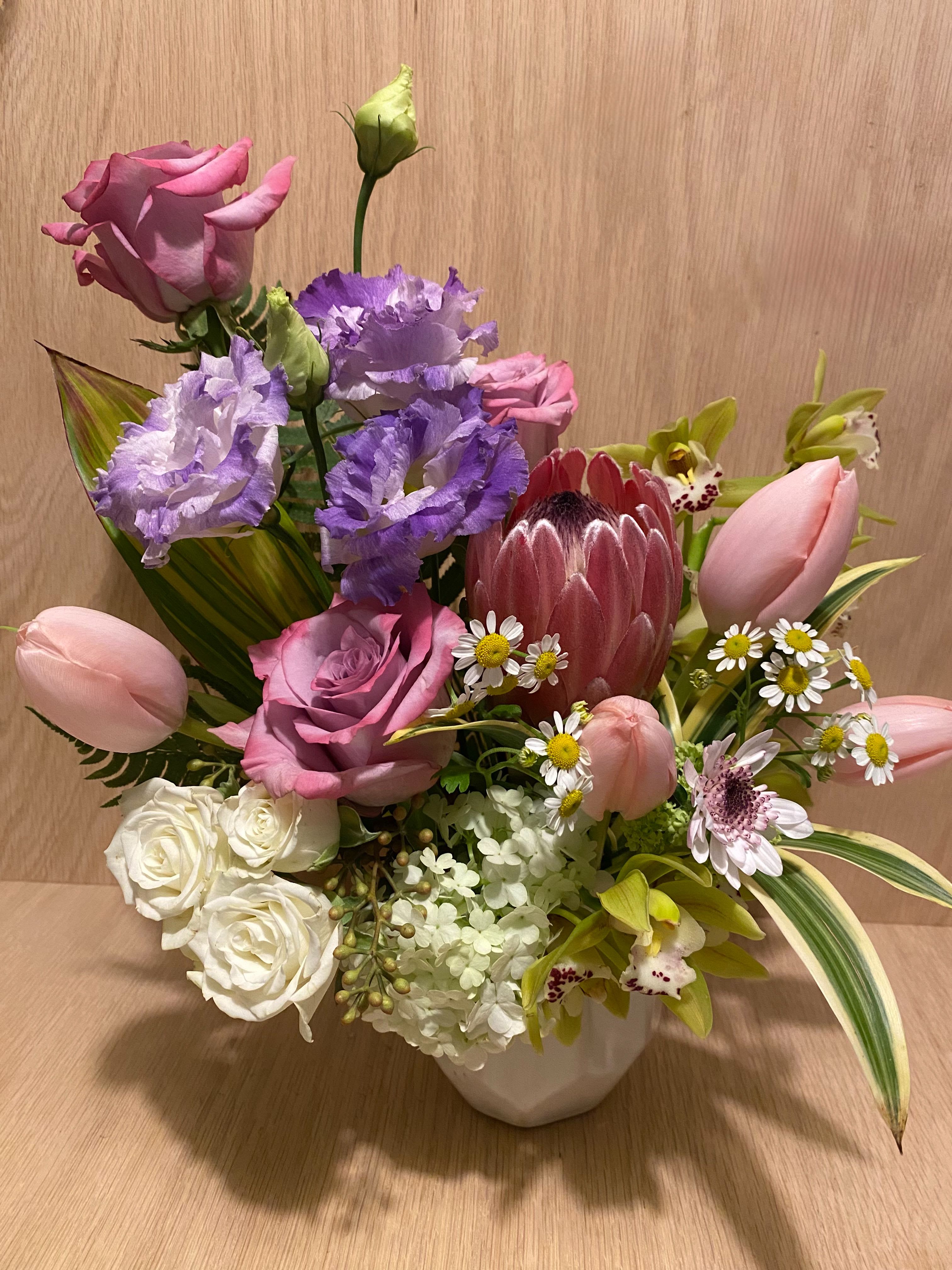 Valentine's Pastel Tropical Blooms - Full of tropical &amp; seasonal blooms in soft &amp; romantic hues for those looking for a unique and fresh take on flowers for Valentine's Day.  Arranged in a vase.