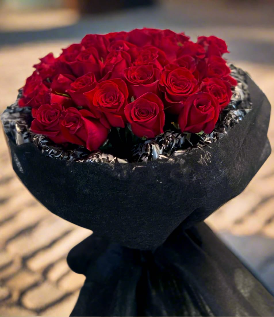 Eternal Love - his stunning bouquet of 24 premium Ecuadorian red roses is a true floral masterpiece, designed to impress with elegance and sophistication.  Perfect for Valentine’s Day, Anniversaries, or any Special Occasion where Love and Passion take center  Substitution &amp; Design Policy  AS SIMILAR AS POSSIBLE  Each floral arrangement is custom-designed and handcrafted using the freshest flowers, containers, decorative accents, and materials available at the time of creation. Due to seasonal availability, immediate inventory conditions, market limitations, or unforeseen circumstances, substitutions of flowers, containers, or decorative elements may be necessary.  When substitutions occur, they will always be made with items of equal or greater value, while preserving the overall style, color palette, proportions, and design integrity of the original arrangement. The final product will be delivered as similar as possible to the design shown.  By placing an order, you acknowledge that all floral designs are unique and that natural variations are part of the artistic and handcrafted process. Our commitment is to deliver the most beautiful and refined version of each arrangement, consistent with our quality standards.