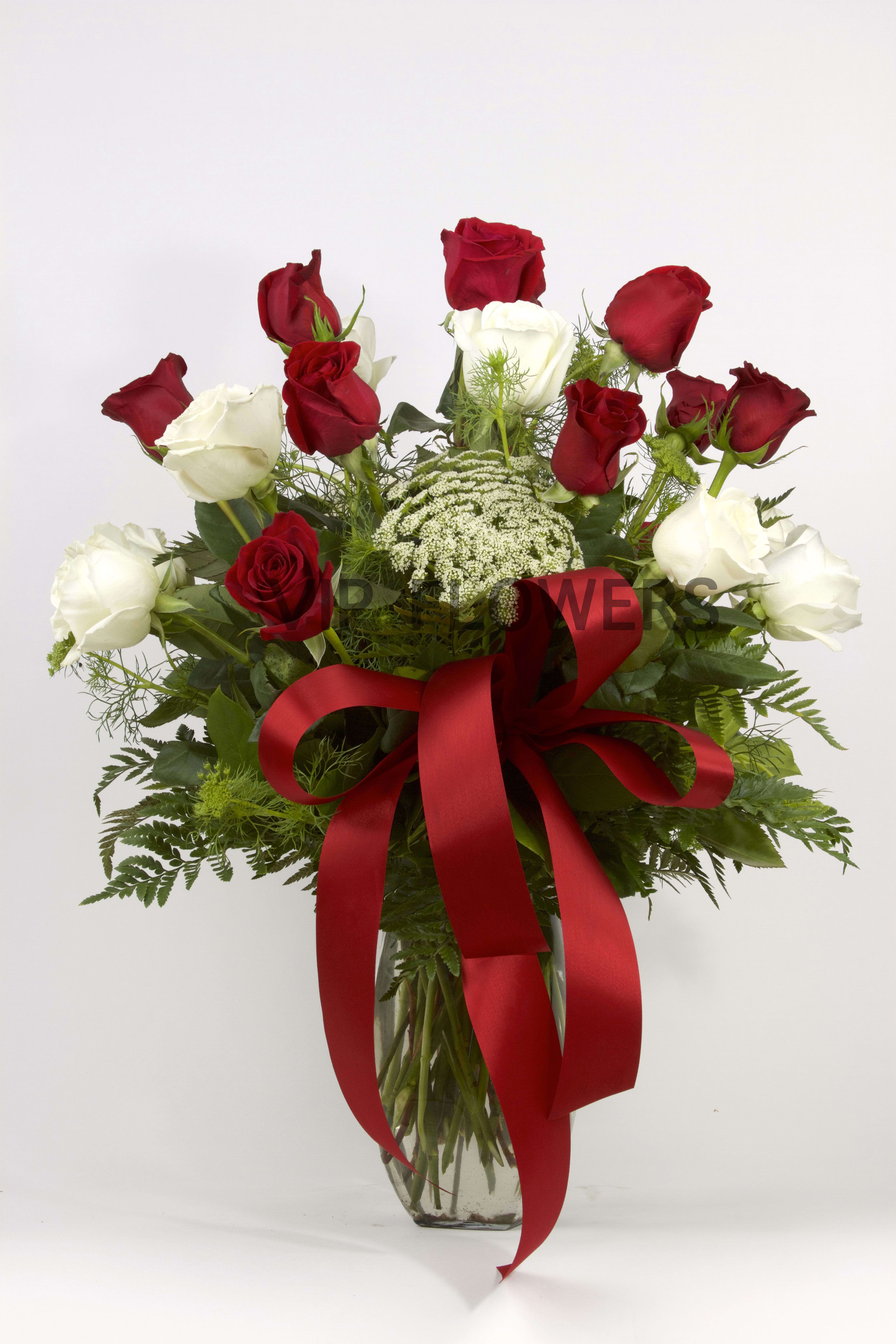 Red + White Romance - Substitutions may be necessary to ensure your arrangement or specialty gift is delivered in a timely manner. The utmost care and attention is given to your order to ensure that it is as similar as possible to the requested item (Please note that some flowers and colors may vary due to seasonality.)