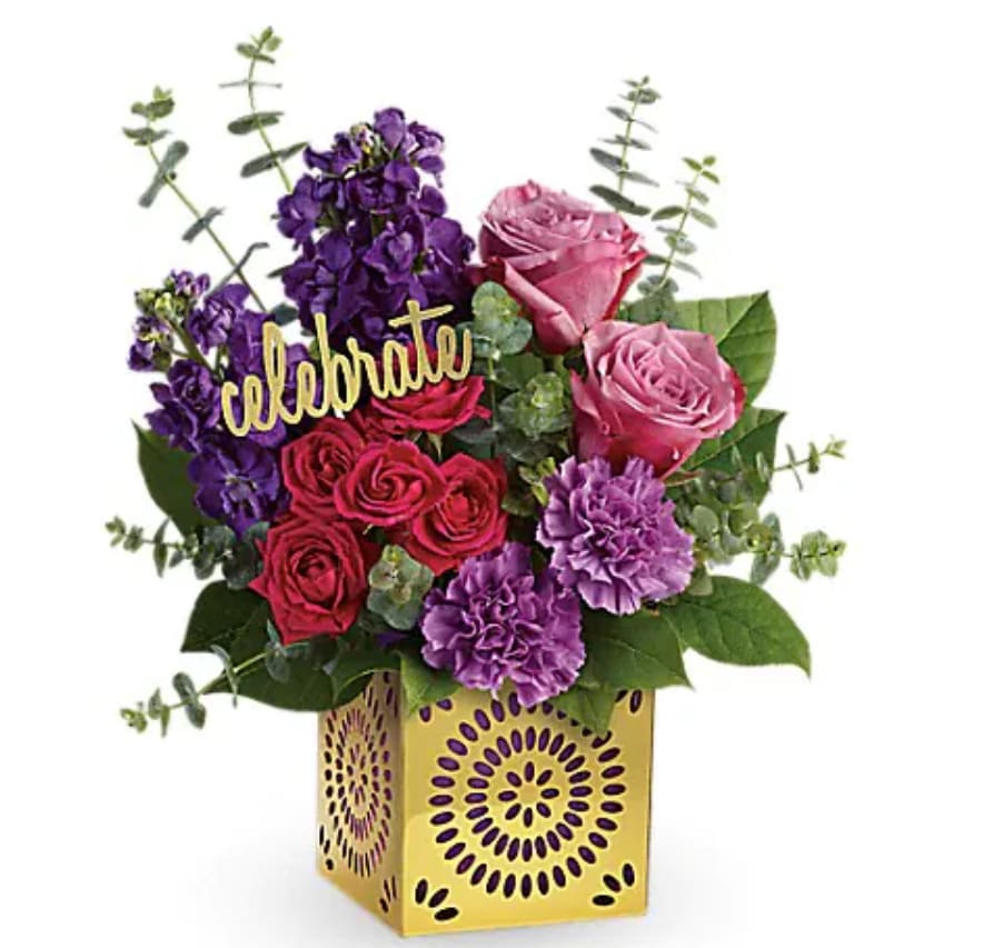 Thrilled For You Bouquet - Celebrate any occasion in style with this glorious gift! Luxurious lavender roses, hot pink spray roses and purple stock are artfully arranged in a golden cube with modern cutout motif. The keepsake cube becomes a stunning candleholder when you remove the pretty purple liner and "celebrate" pick! Lavender roses, hot pink spray roses, purple stock, and lavender carnations are arranged with spiral eucalyptus and lemon leaf. Delivered in a Celebrate in Style cube.   Orientation : One-Sided  All prices in USD ($)  Standard  TBC03-2A  Deluxe  TBC03-2B  Premium  TBC03-2C