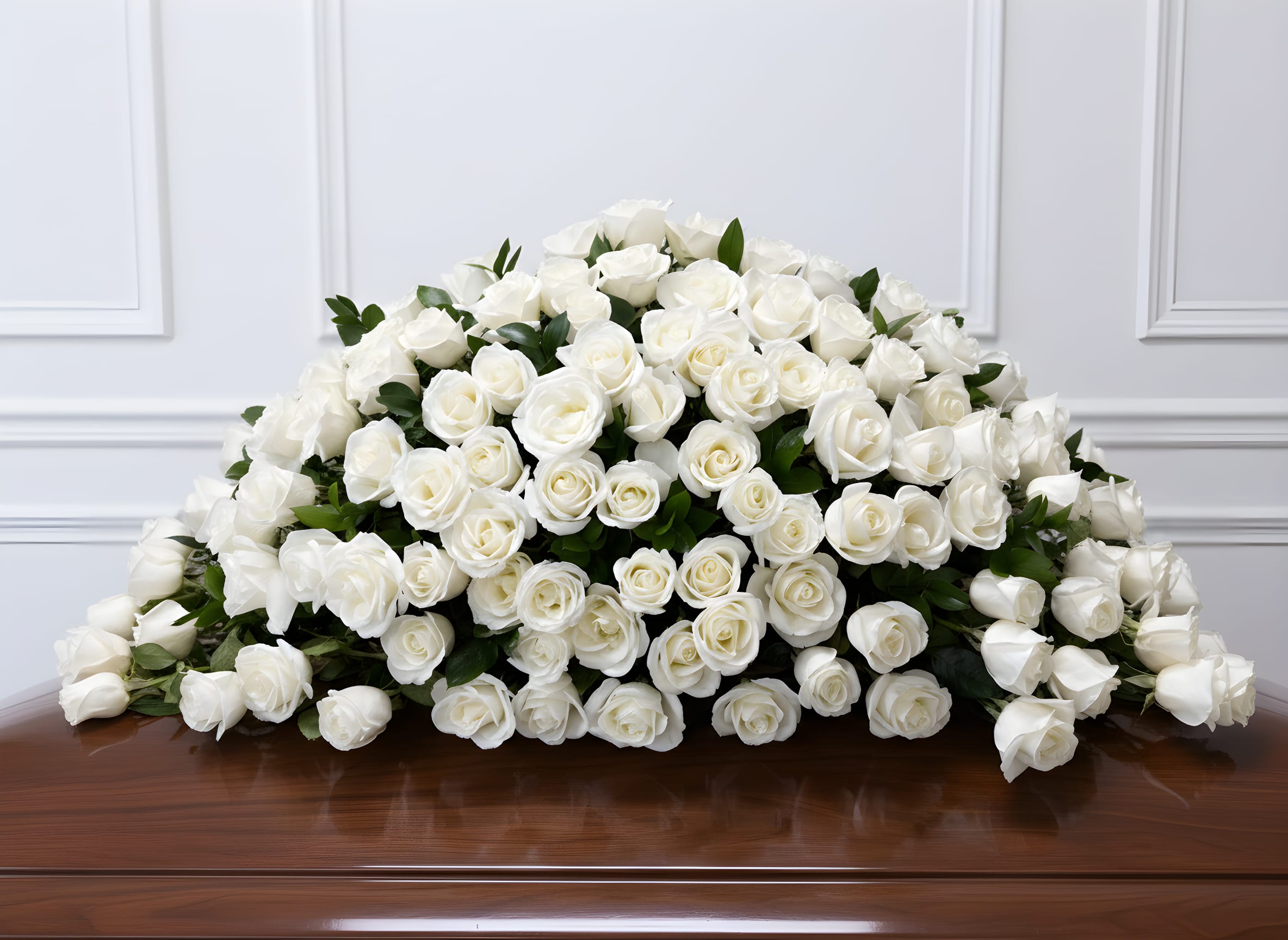 Eternal Grace White Rose Casket Spray - An exquisite casket spray featuring fresh white roses arranged in a flowing, luxurious design. Perfect for expressing sympathy, respect, and everlasting love. Designed with care and available for funeral home or church delivery.