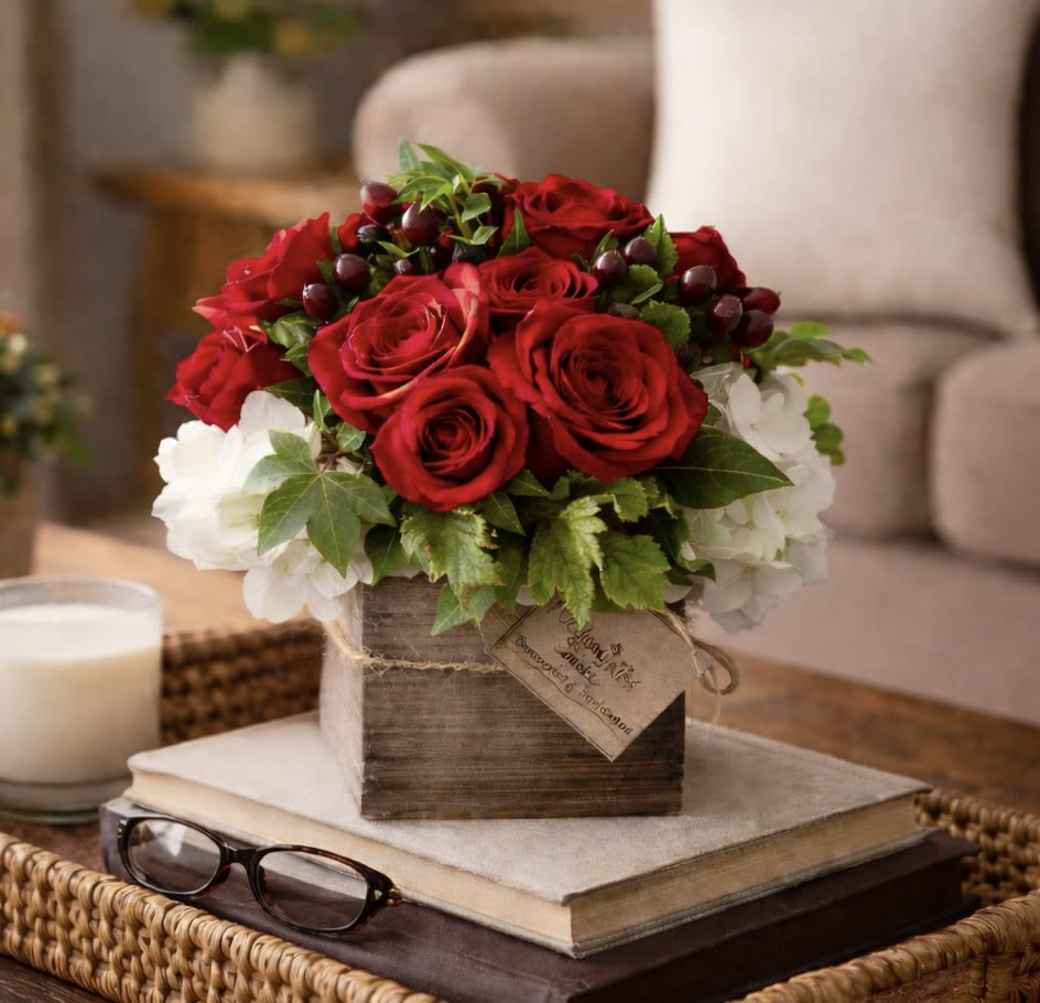 Embrace (Petite) - The Embrace is apart of our Petite collection. All good things do come in small packages as this arrangement is a beautiful combination of Red Roses, Red Tulips, White Spray Roses in a 4x4 white wash wood box. Send someone a small embrace they can enjoy on their desk  at work or on the coffee table at home. 