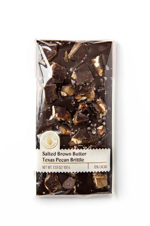 Wildwood - Salted Brown Butter Texas Pecan Brittle Bar - This satisfying crunchy salted brown butter pecan brittle covered in rich 70% dark chocolate has it all!    Enjoy on its own or crumbled on top a bowl of vanilla ice cream.    100 grams