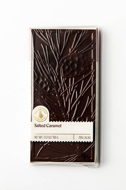 Wildwood - Salted Caramel - Caramel enhanced with a dash of sea salt covered in layers of rich 70% dark chocolate. This bar is like a trusty friend - always there for you. 100 grams * This product comes in three different pattern designs. Design is not guaranteed with order.