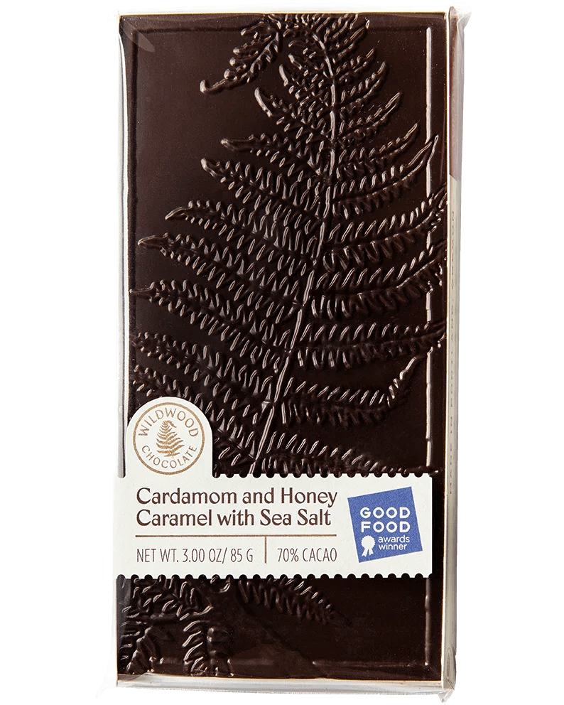 Wildwood Chocolates - Cardamom and Honey Caramel with Sea Salt - Giving you warm comforting satisfaction, cardamom and honey cozy together in a sheet of hand-made caramel covered in layers of rich 70% dark chocolate sprinkled with sea salt.  Enjoy while dreaming of relaxing in front of a warm fire.  Good Food Award Winner!  100 grams.  