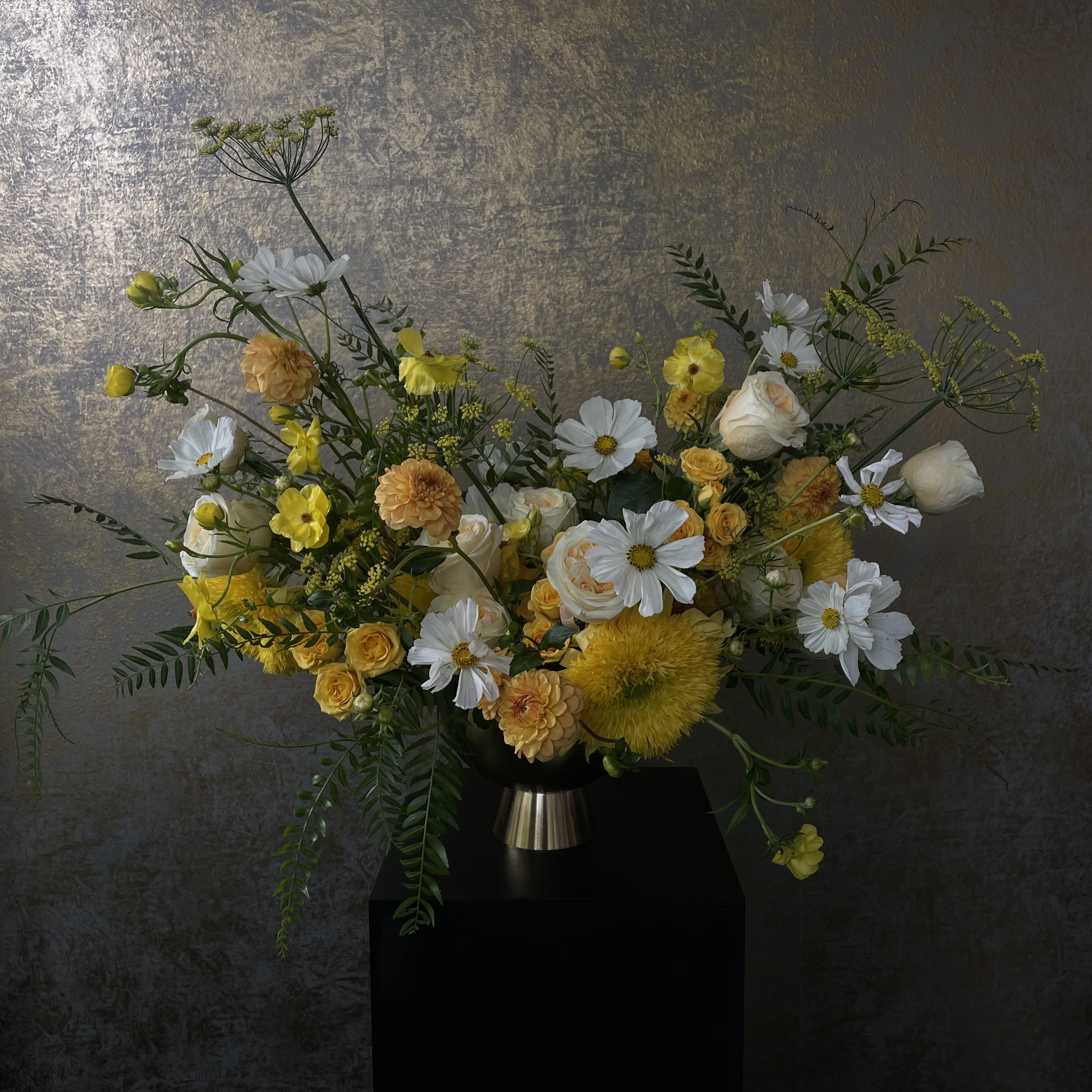 VIBRANT. Designer's Choice Compote Vase Arrangement - Our Designer’s Choice Compote Arrangement is bursting with vibrant color and creative flair. Designed in a footed compote vase, this arrangement brings movement, texture, and bold seasonal blooms together in a low, artful silhouette.