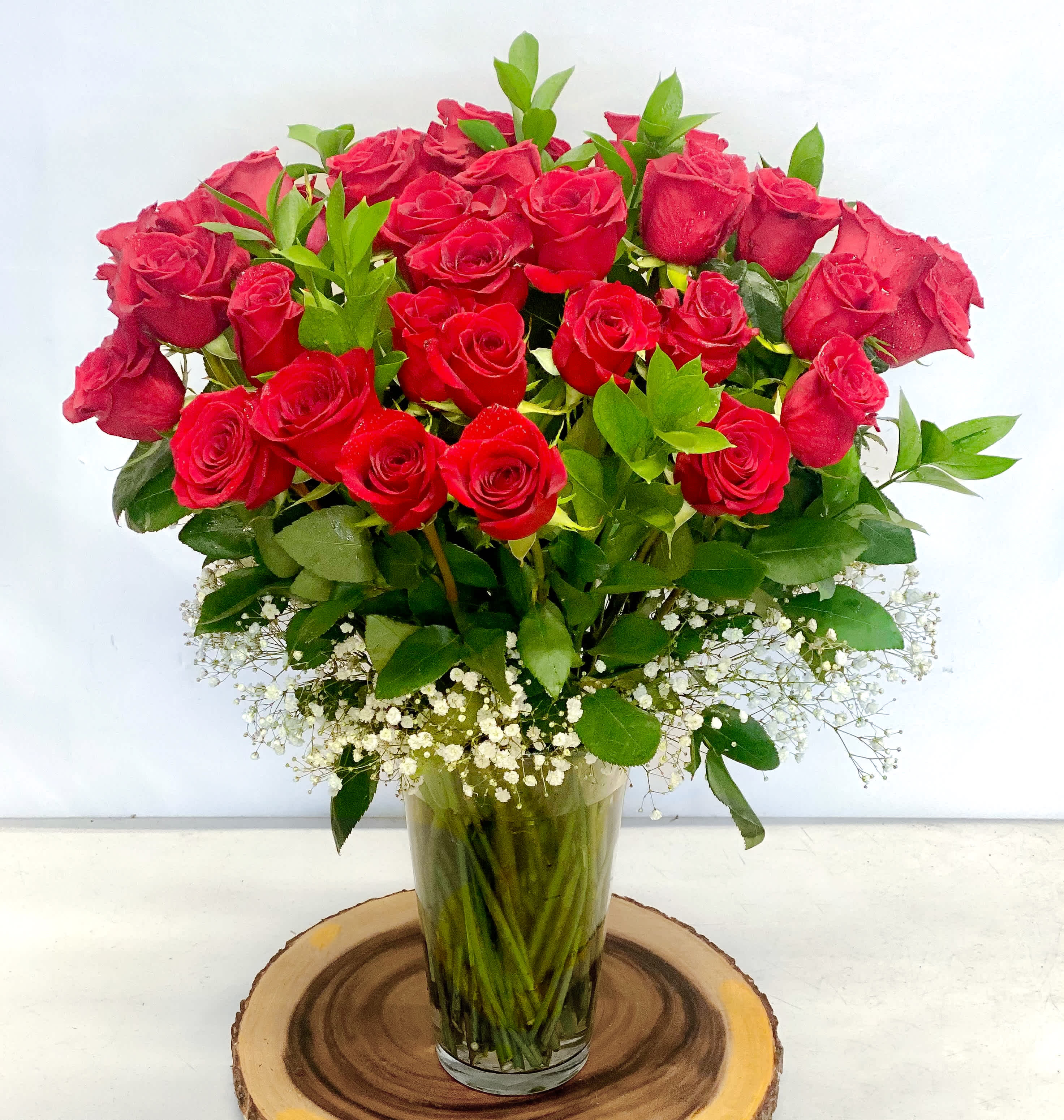 Grandeur Roses  - Go big with your love by sending the most extravagant 3 dozen or 36 of our tallest Ecuadorian roses in luxury with your bold statement of "I love you" in 36 different ways!  Approximately 28" H x 18” W