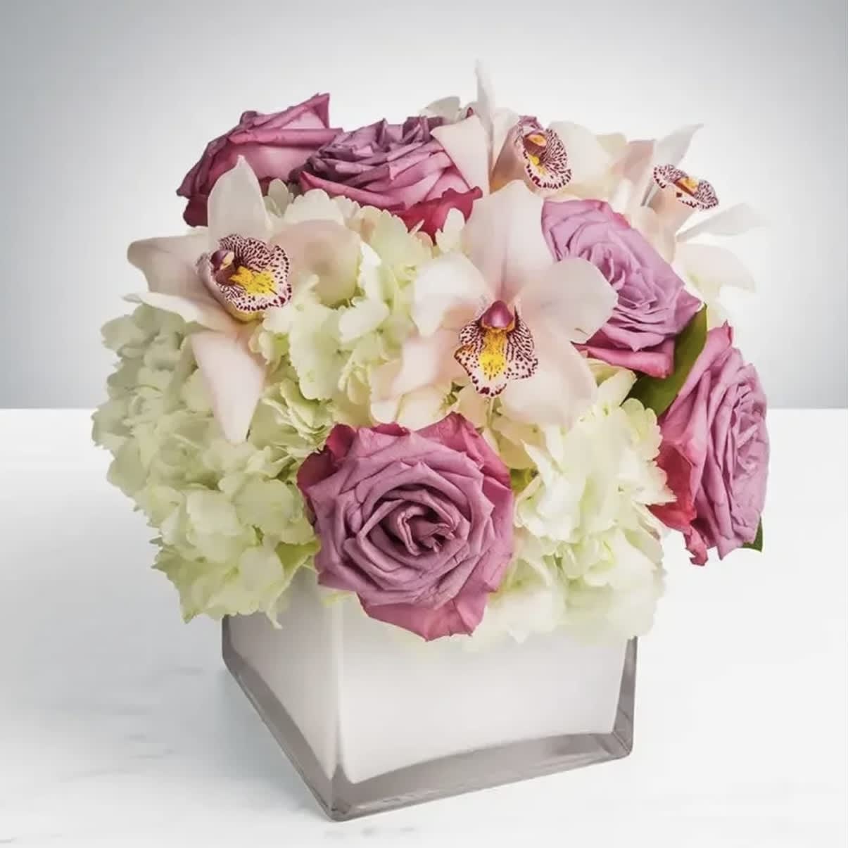 Pop of Lavender - The bouquet that’s as versatile and sophisticated! This is the perfect gift for all occasions and guaranteed to be remembered and appreciated for life.  Approximately 9” D