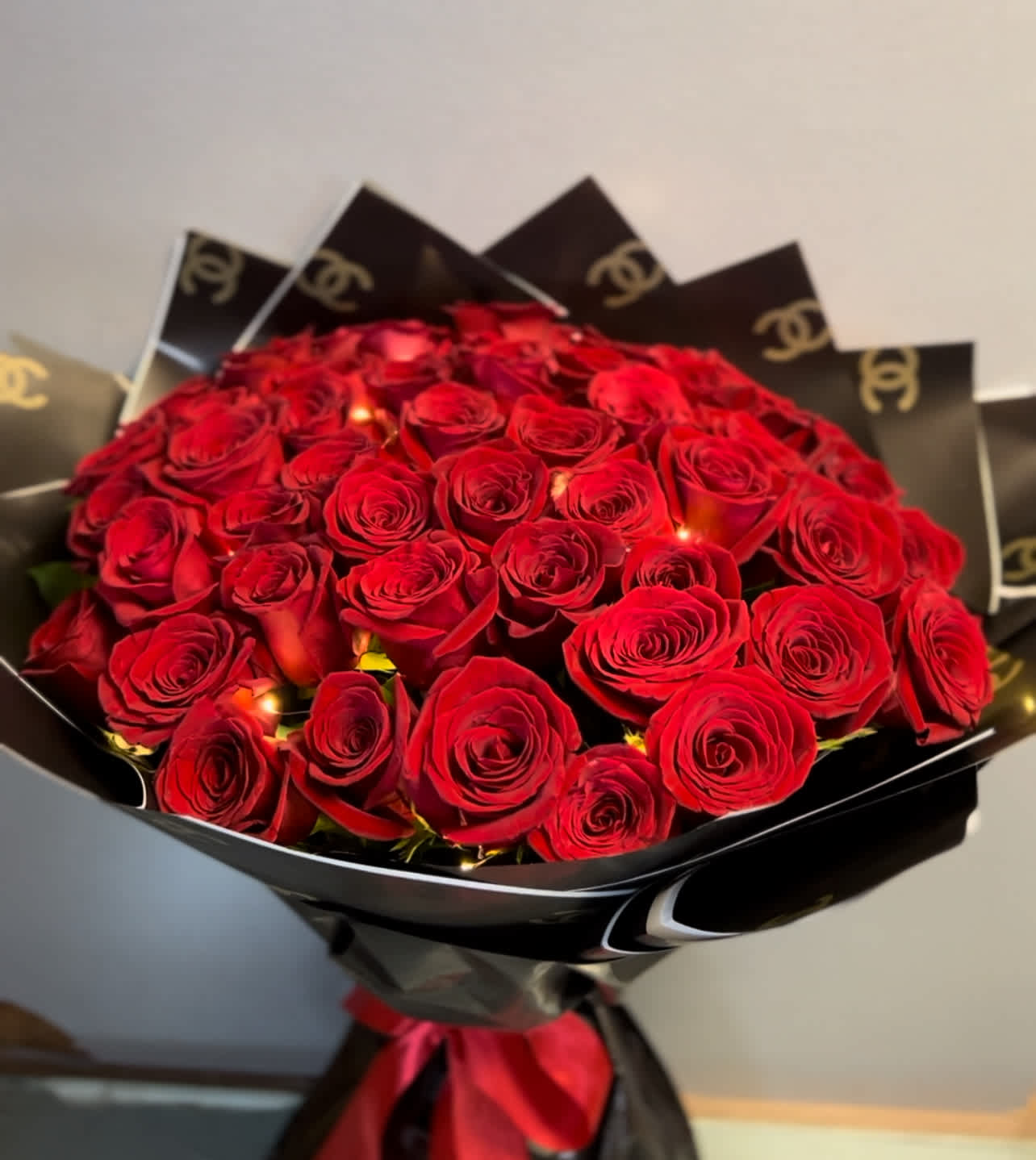 Radiant Elegance - Ecuadorian Roses  Substitution &amp; Design Policy  AS SIMILAR AS POSSIBLE  Each floral arrangement is custom-designed and handcrafted using the freshest flowers, containers, decorative accents, and materials available at the time of creation. Due to seasonal availability, immediate inventory conditions, market limitations, or unforeseen circumstances, substitutions of flowers, containers, or decorative elements may be necessary.  When substitutions occur, they will always be made with items of equal or greater value, while preserving the overall style, color palette, proportions, and design integrity of the original arrangement. The final product will be delivered as similar as possible to the design shown.  By placing an order, you acknowledge that all floral designs are unique and that natural variations are part of the artistic and handcrafted process. Our commitment is to deliver the most beautiful and refined version of each arrangement, consistent with our quality standards.