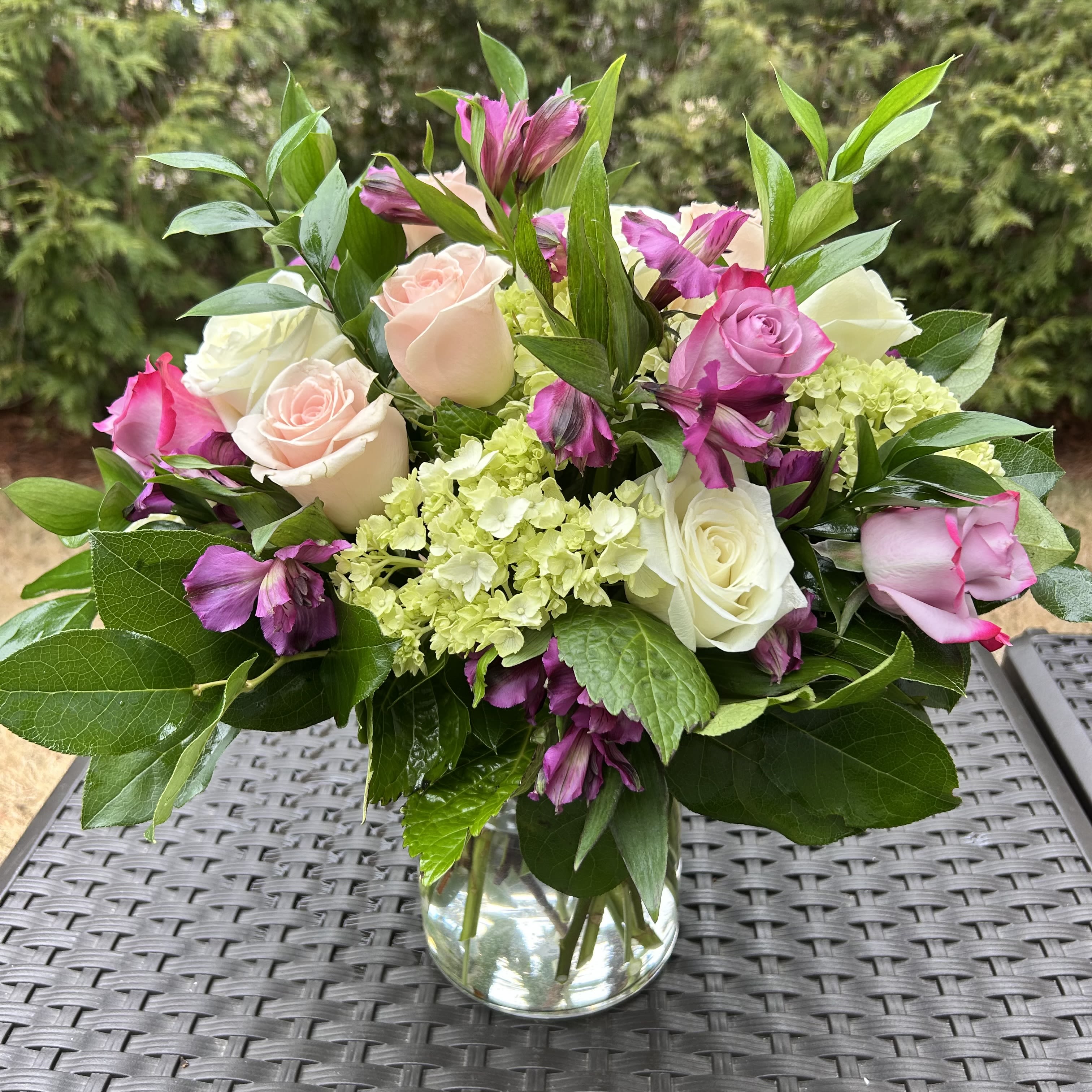 Greta - This arrangement a true symbol of luxury.  Bloom Details: White Roses, Green Hydrangeas, Pink Roses, Pink  Alstroemeria  Crystal Clear Glass Vessel All Occasion  Place your Order Online Monday to Saturday before 1:00 p.m. (E.T.) for same-day delivery. “Orders received after hours will be delivered the next business day”. Check our coverage area. Occasionally, substitutions of flowers and/or containers happen due to weather, seasonality, and market conditions which may affect availability. If this is the case with the gift you’ve selected, we will ensure that the style, theme, and color scheme of your arrangement are preserved and will only substitute items of equal value or higher value.  CARE INSTRUCTIONS Keep the flower arrangement hydrated with natural water and change the water every two days. Do not spray any cleaning product on the flower arrangement. Do not place heavy objects directly on the flower arrangement. Keep flower arrangements out of direct sunlight and extreme heat.