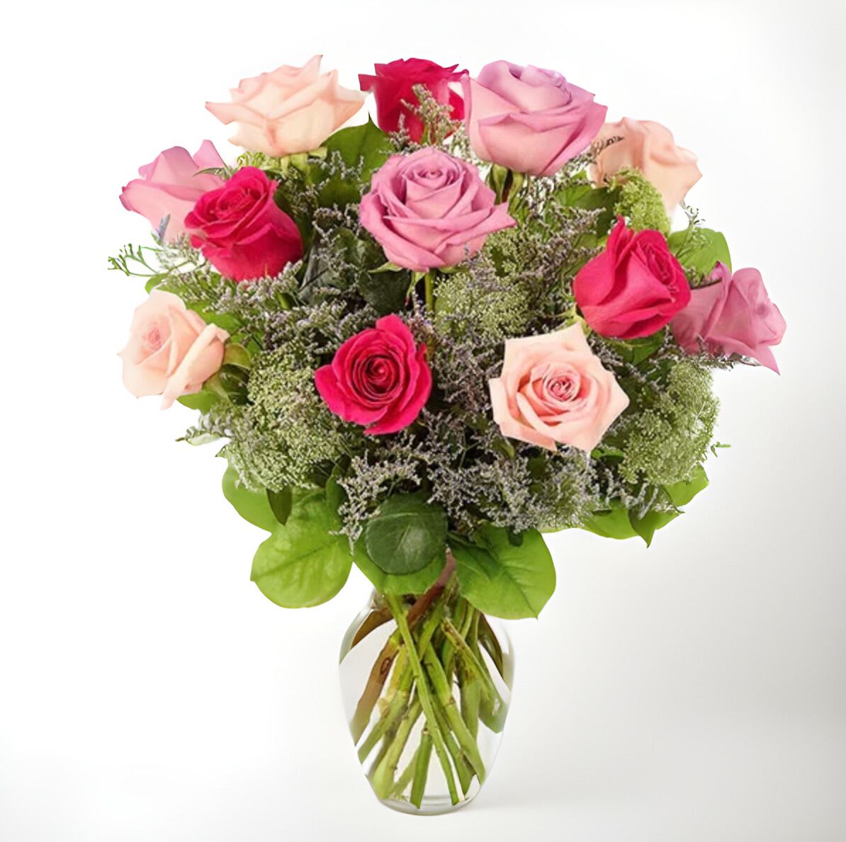 A Kiss of Roses - This is a beautiful bouquet of roses in various shades of pink and red. The arrangement includes a mix of light pink, hot pink, and red roses, creating a vibrant and romantic display. The roses are artfully arranged with greenery and filler flowers, adding depth and texture to the bouquet. The overall effect is a lush and elegant floral presentation that would be perfect for a special occasion or to express love and appreciation.
