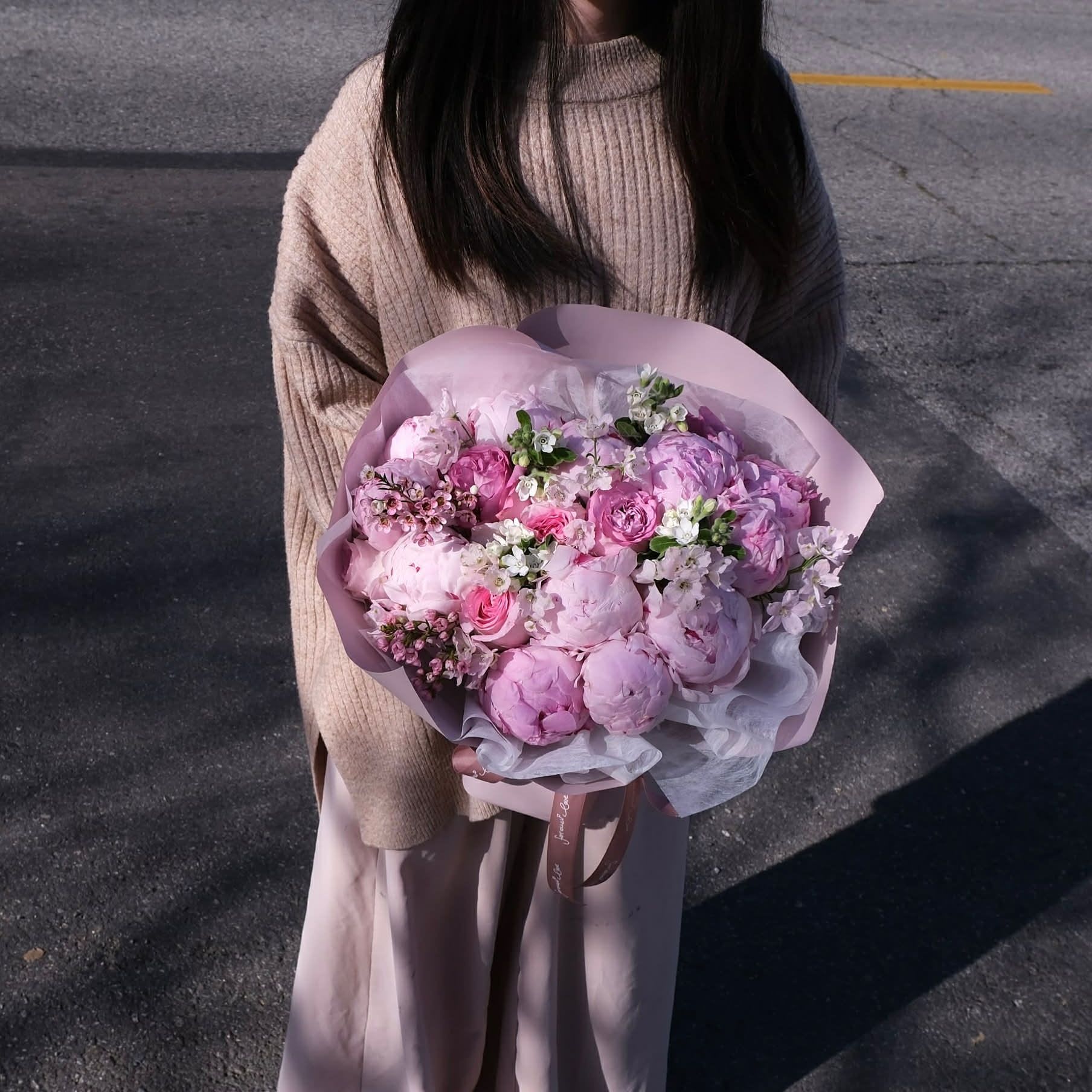 Peonies × Roses — the dream duo - A cloud of blush peonies and garden roses wrapped in soft pink tones, designed to bring warmth, sweetness, and a little magic into someone’s day. Perfect for celebrating love, gratitude, or simply making an ordinary moment feel extraordinary.