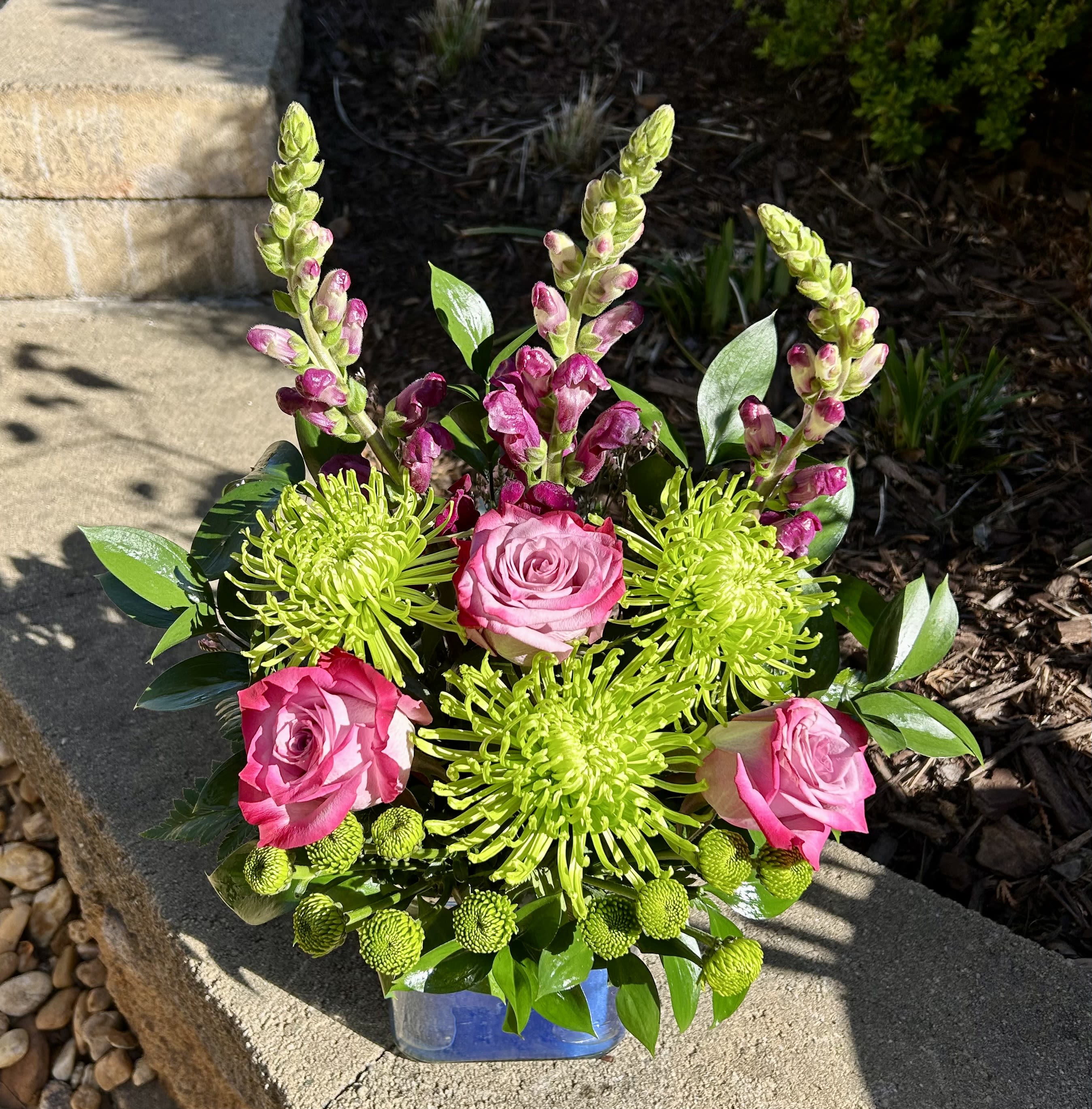 Soothing Lavender - A lavender arrangement of roses and snapdragons with green mums to help make someone’s day soothing.