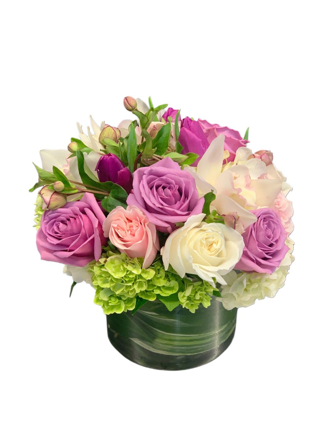 Lavender Mist - Pretty spring florals in shades of lavender, cream and green in a clear glass vase 