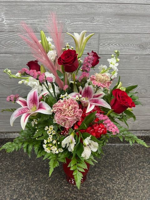 Valentines25 #2 - Sure to make anyone smile-this beautiful arrangement contains: Red roses, stargazer lily, hydrangea, dianthus, and more along with mixed greenery including eucalyptus THIS WILL ONLY BE FOR VALENTINE PRE ORDERS  ORDER FROM JANUARY 17-FEBRUARY 12th