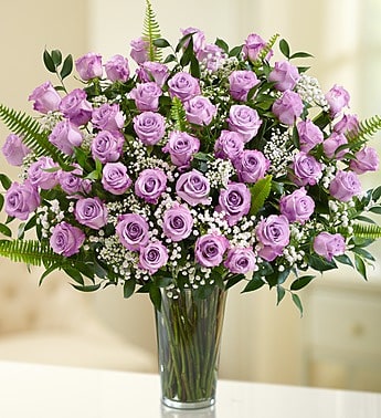 Lavender Roses - 12, 24 or 36 Long Premium LAVENDER Roses arranged in a vase with greens and baby's breath.