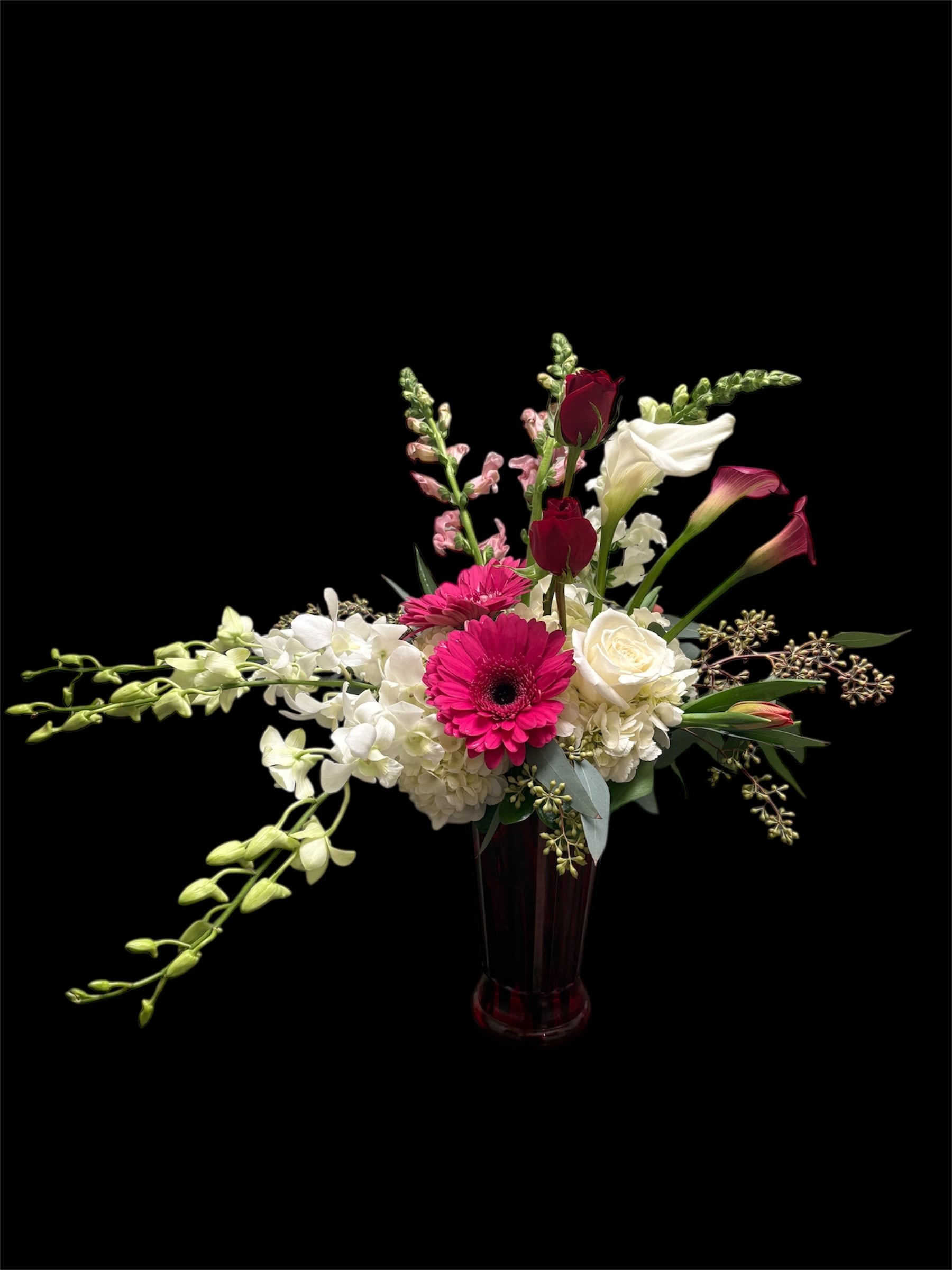 Eternal Love - If you could dream up the most romantic way to send your love, this would be it. Our Eternal Love bouquet is gathered with a mix of blooms in a red tall vase, surprise them in luxurious style.  