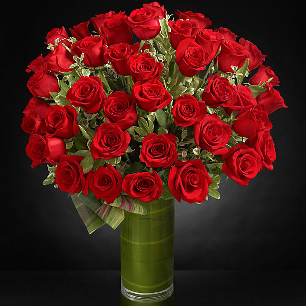 Fate Luxury Bouquet - A gorgeous and lush bouquet of 48 premium long-stemmed red roses, beautifully situated in a superior glass vase. 