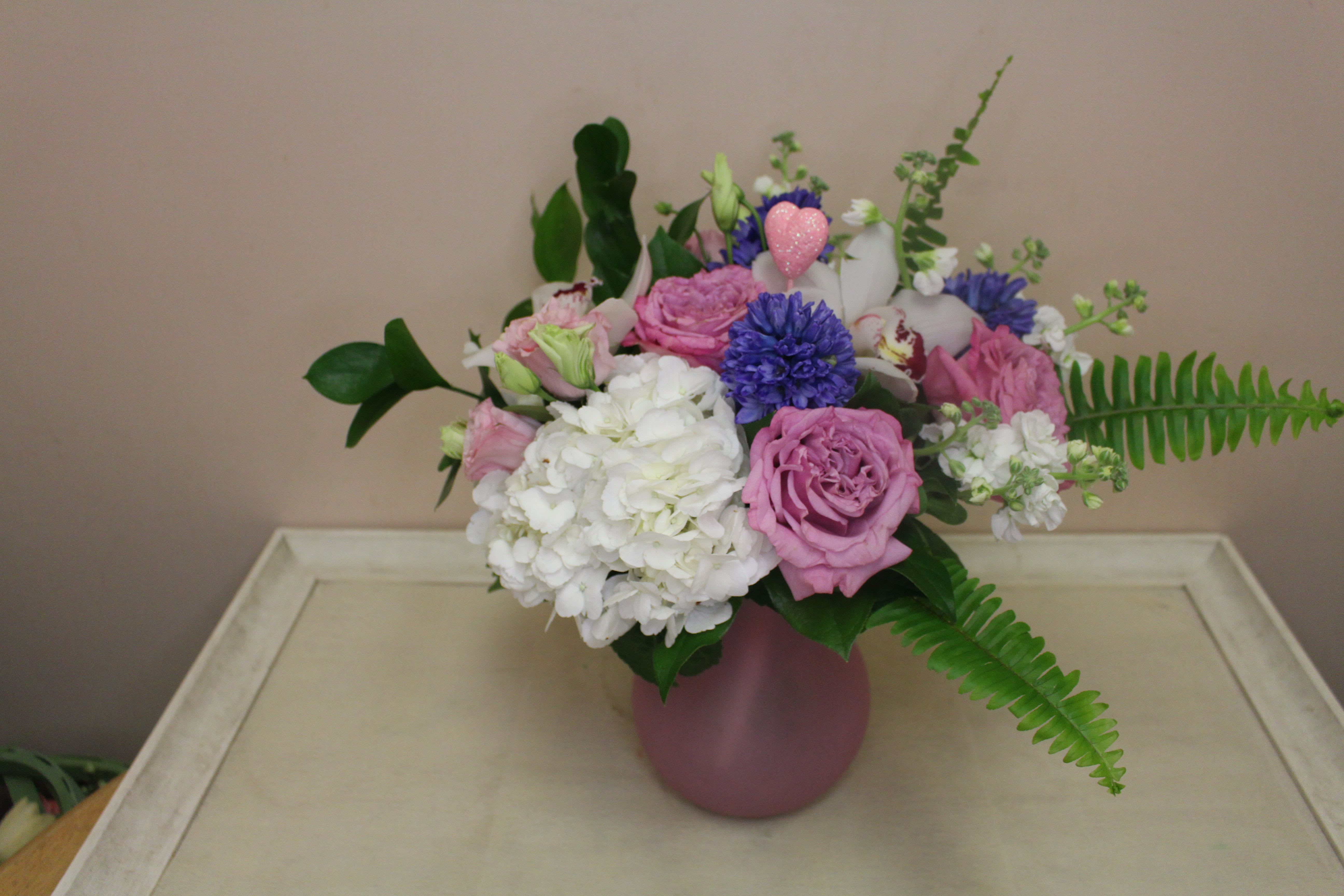 Enchanted - Make this the sweetest Valentine's Day yet with a pretty set of perfectly sweet blooms.  