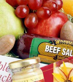 FTD Florist Designed Gift Basket Premium - Can't decide which gourmet gift to send? Let the florist design something special using their best gourmet gift ideas. This premium item will be arranged in a basket and reflect the amount you have spent.