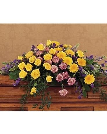 Eternal Hope Casket Spray - This bright and beautiful casket spray with its yellow roses and gerberas offers the notion that hope is eternal. One half-couch casket spray arrives filled with yellow roses and gerberas, purple larkspur, variegated purple carnations and soft foliages. Approximately 60" W x 16" H Orientation: All-Around As Shown : TF204-3